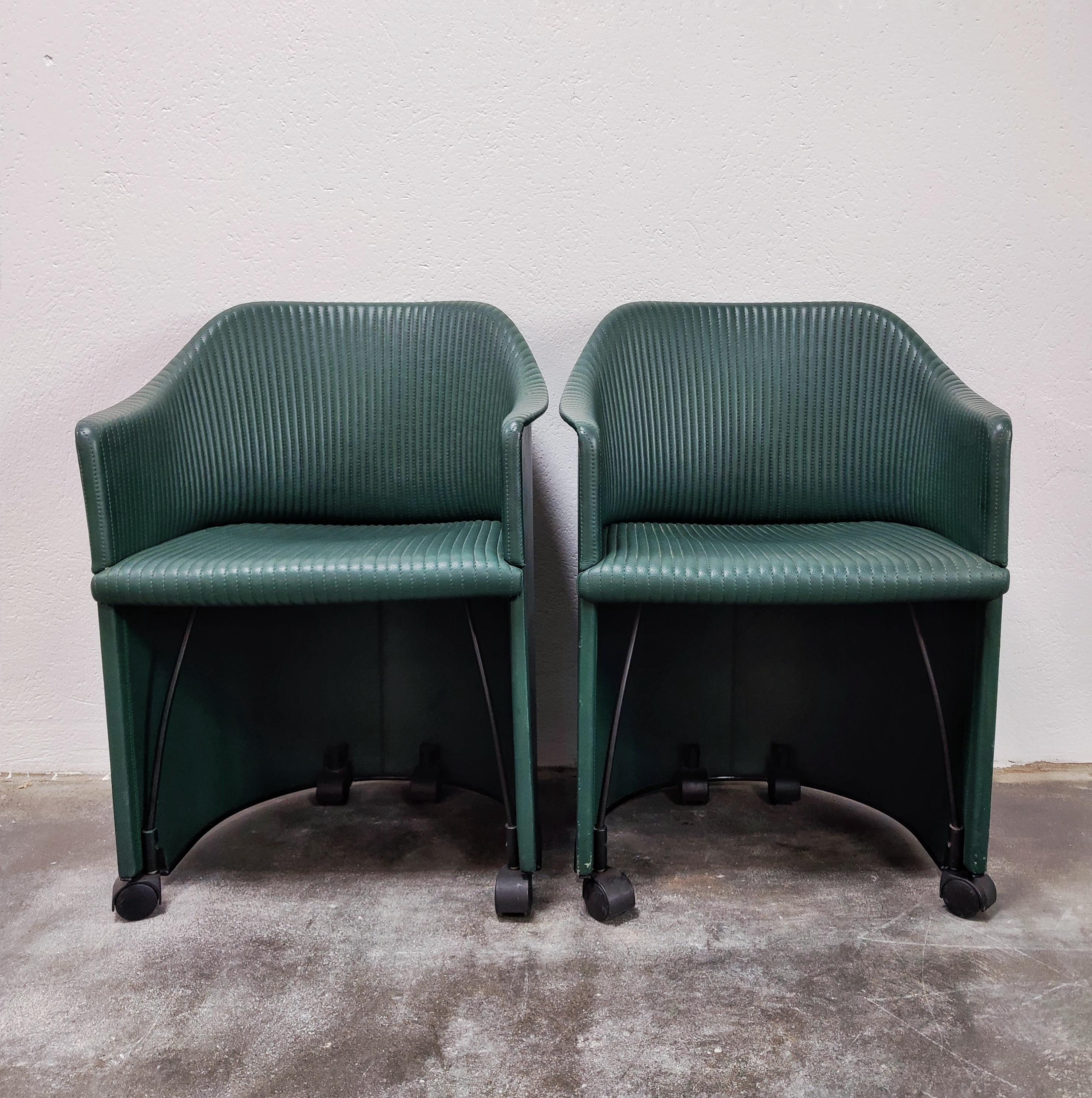 In this listing you will find a pair of very rare leather armchairs designed by Italian duo Afra and Tobia Scarpa. The armchairs were manufactured by Maxalto as a part of their Artona Collection in the mid 80s, and is known as Model 8552. They