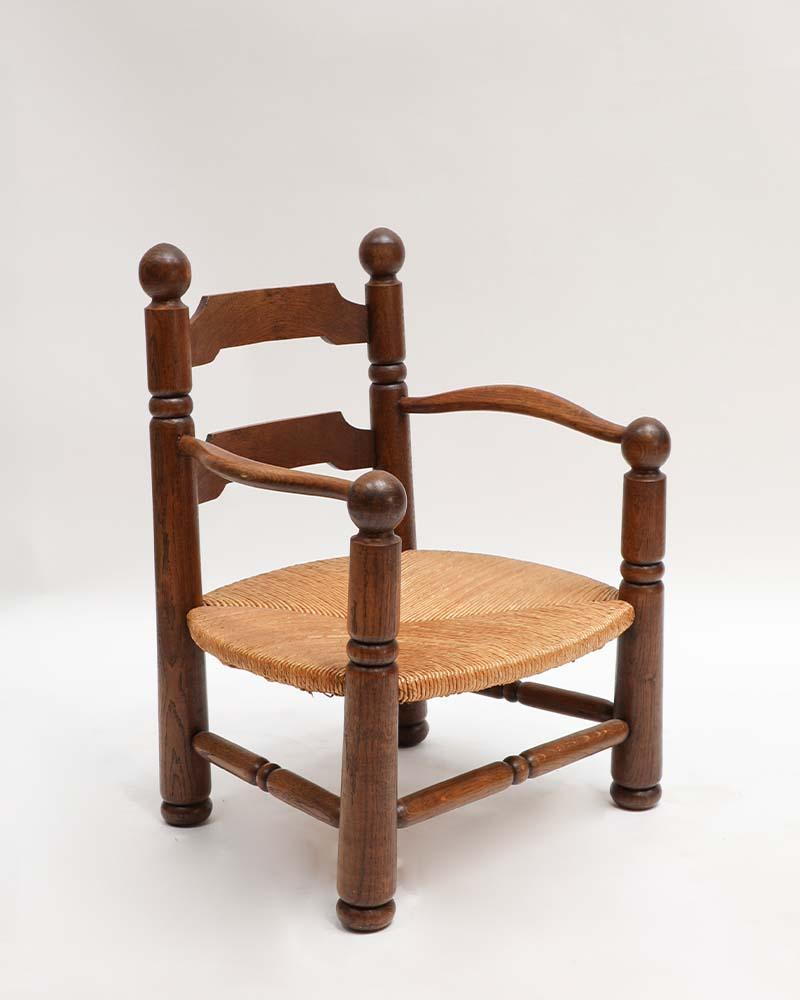 A 1940s French armchair by Charles Dudouyt, considered one of his iconic designs. It features his signature carved oak, bold proportions, and sculptural frame — a timeless piece that captures the strength and refinement of his work. 