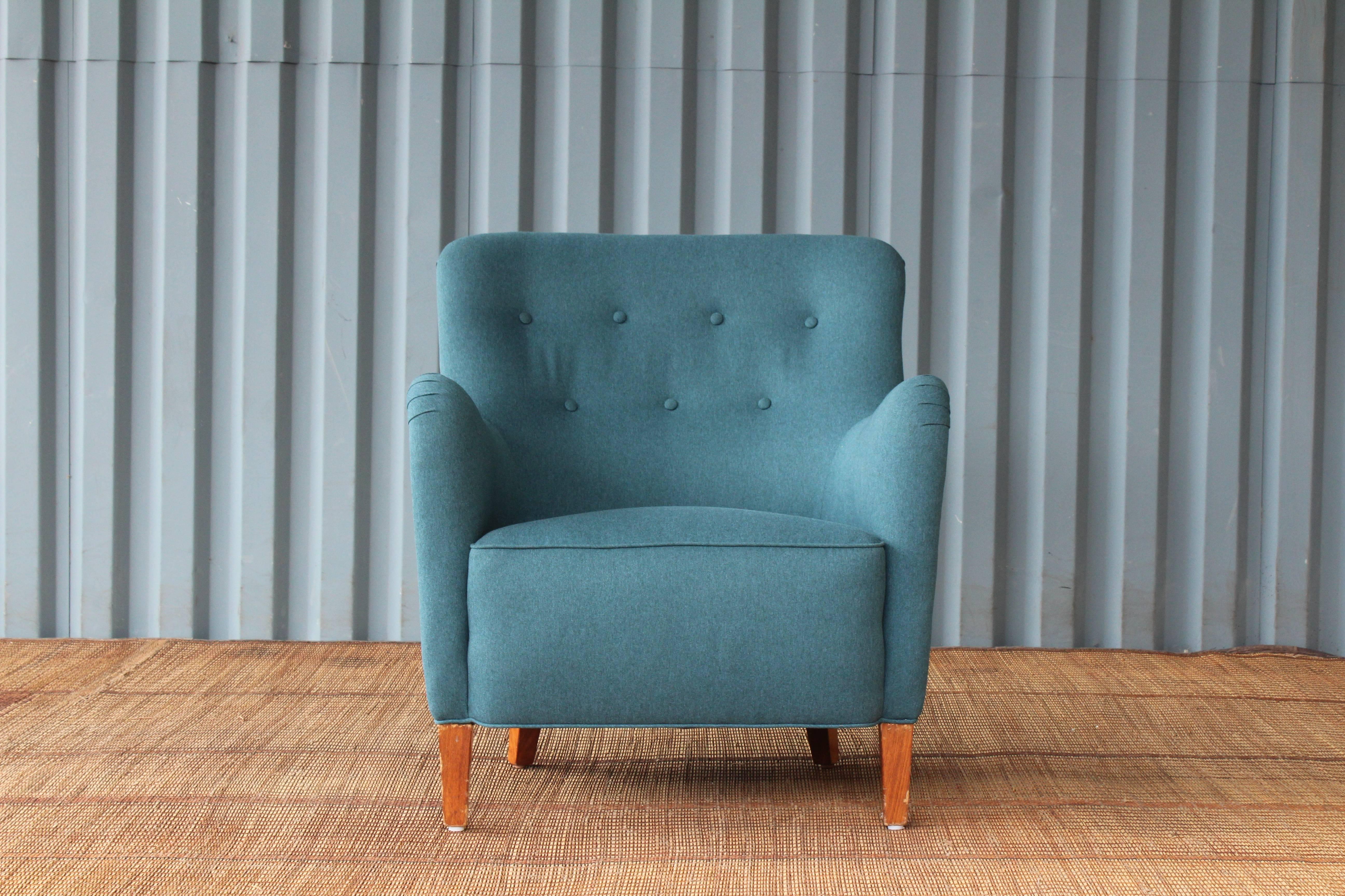 Early modern armchair designed by Ernest Race, England, 1940s. Recently upholstered in a beautiful dark teal fabric. His and her pair available.
 