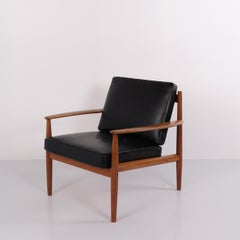 Armchair by Grete Jalk for France & Søn in teak and black leather, 1960s