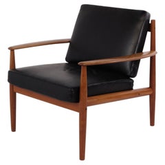 Armchair by Grete Jalk for France & Søn in teak and black leather, 1960s