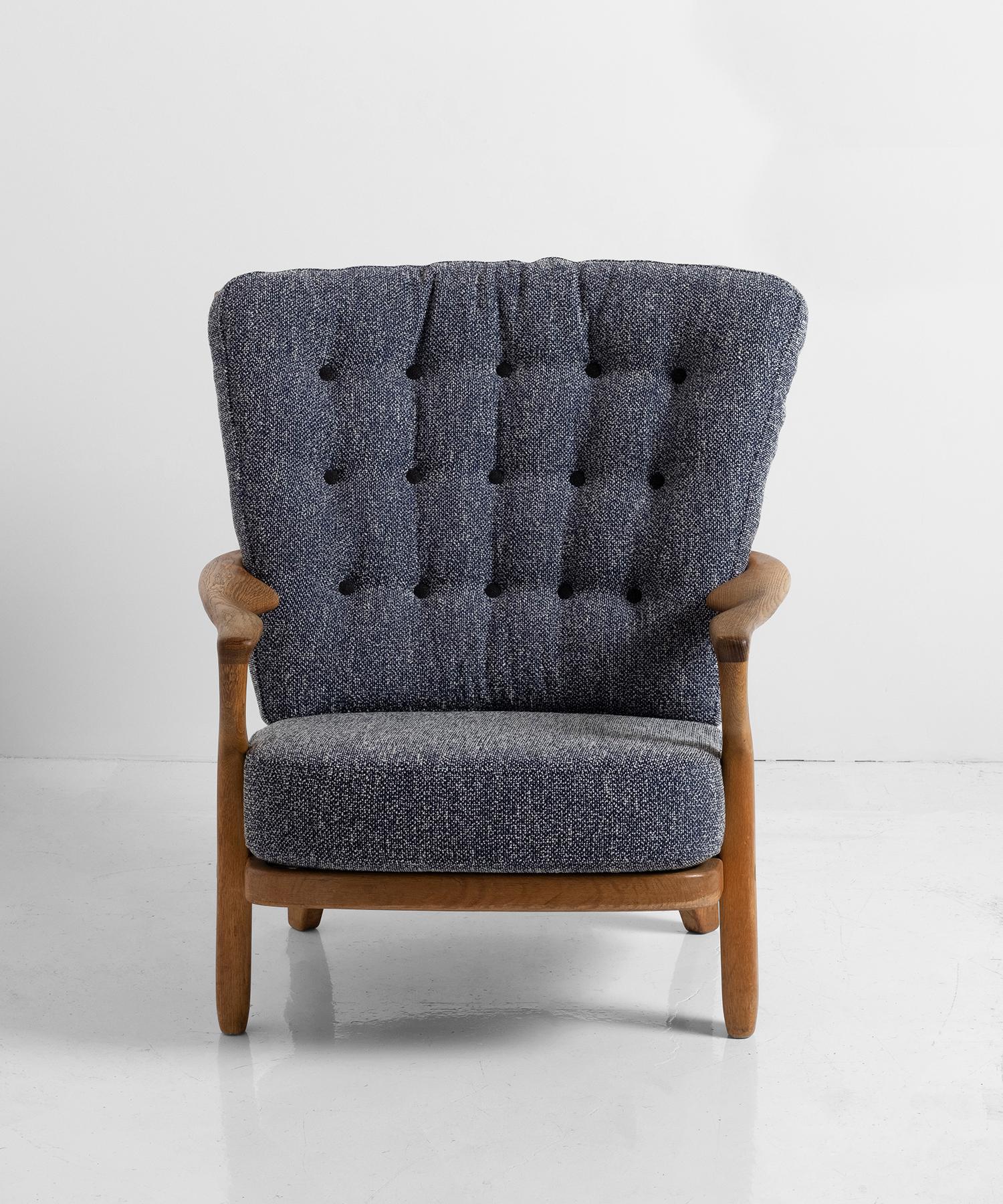 Armchair by Guillerme et Chambron, France, circa 1950
Carved oak frame with upholstered seat and back.
   