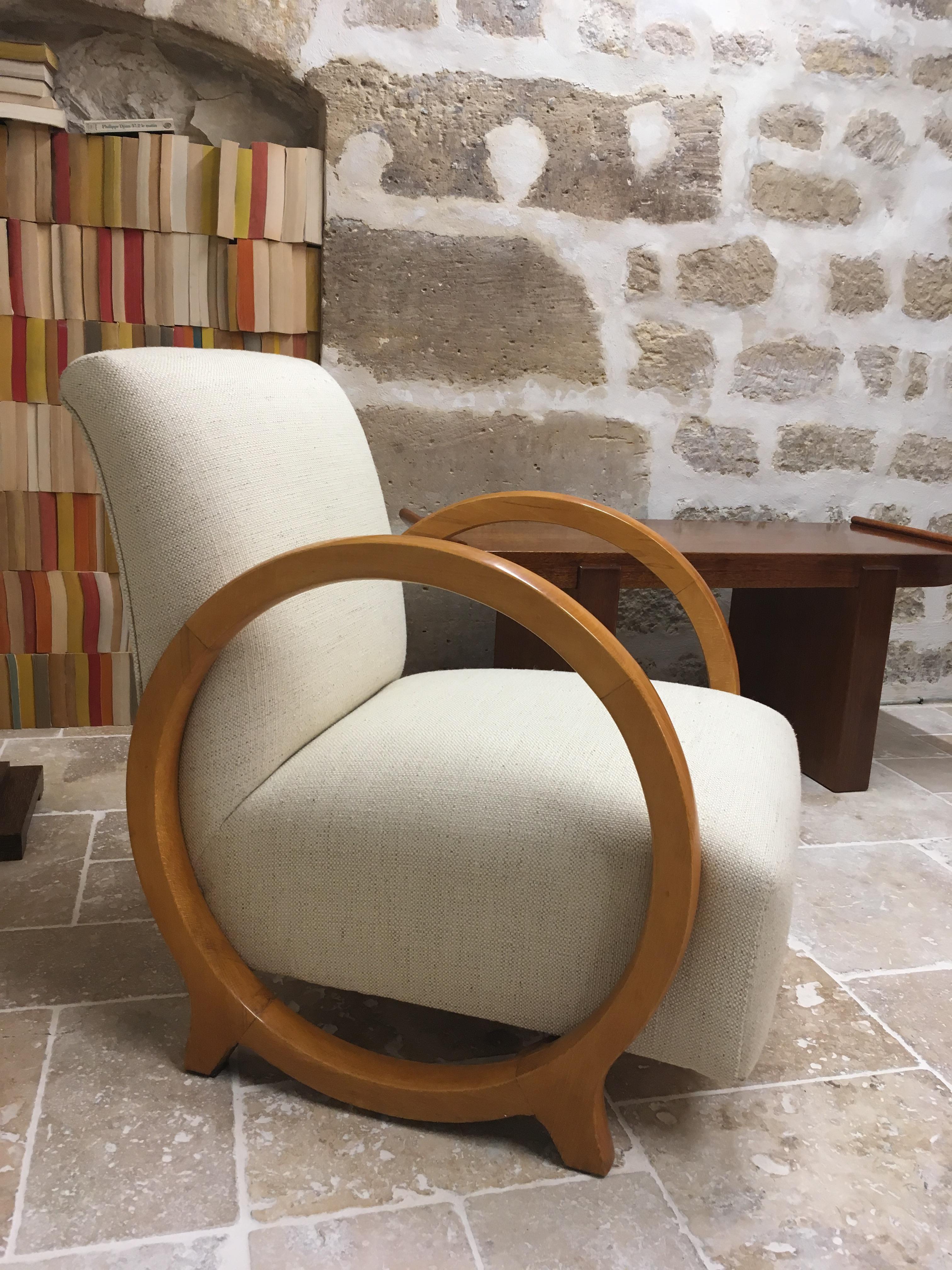 A rare modernistic armchair by great French designer of 20th century Jacques Adnet (1901-1984) for the Compagnie des Arts Français.
It made from tinted beechwood with two circular armrests forming the base.
The seats and backrests are covered with