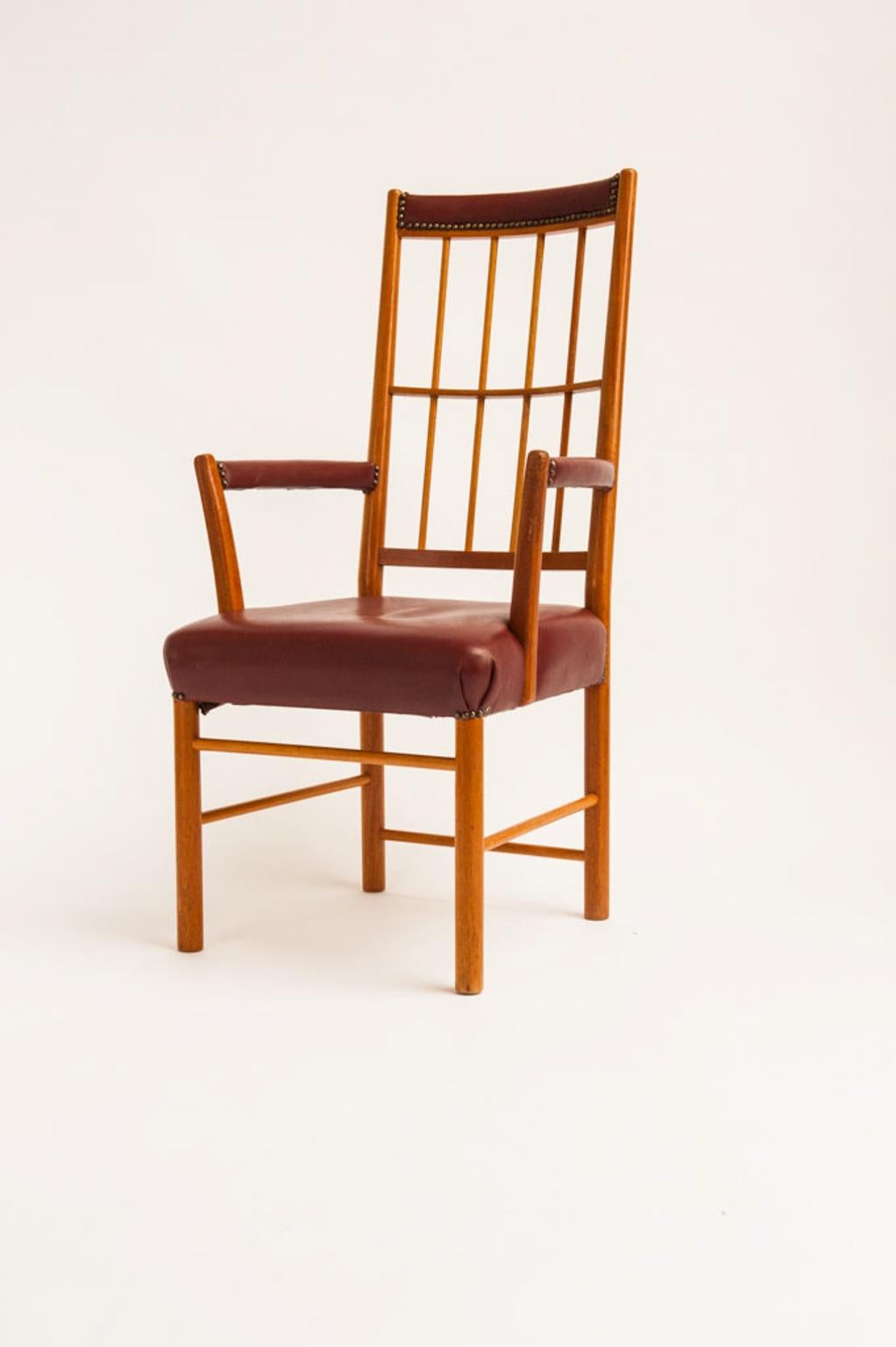 Beautiful armchair, model 652, designed by Josef Frank for Svenskt Tenn. Frame in mahogany. Upholstered with wine red leather.

This elegant armchair was designed by Josef Frank in 1936 and three years later, it was used at the Golden Gate