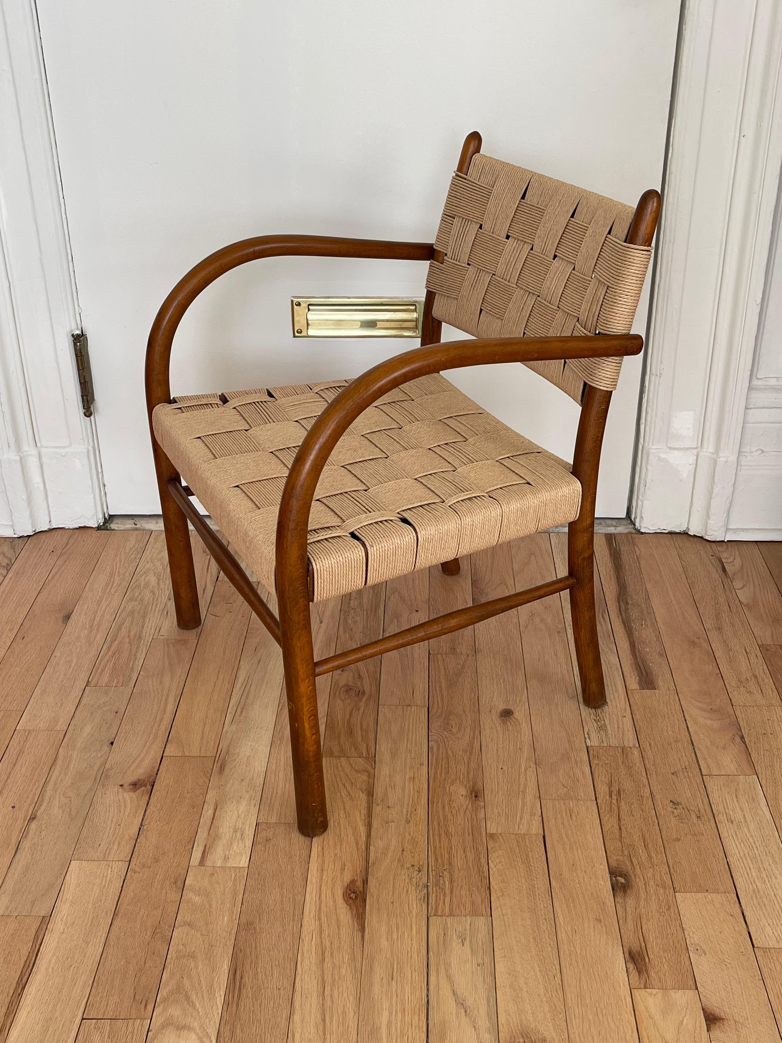 Manufactured by Fritz Hansen, 1938.

Restored beech armchair with woven papercord back and seat. This chair as well as other models have been commonly attributed to Frits Schlegel. However the original Fritz Hansen catalog from 1938 reveals that