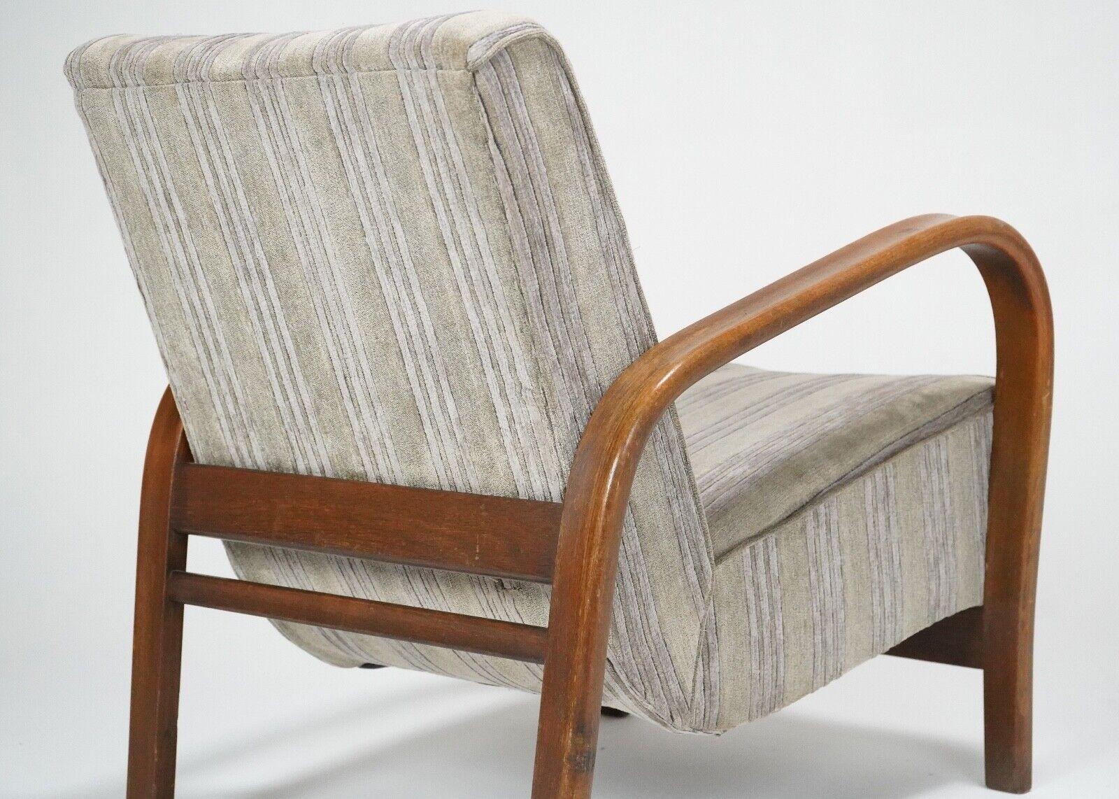 A Bentwood armchair by Kozelka and Kropacek for interior praha, circa 1950. 
In good all round condition, left in its original upholstery, spring core in perfect condition, very study and comfortable. 

Dimensions

H 77cm W 67cm D 78cm SH 44cm
