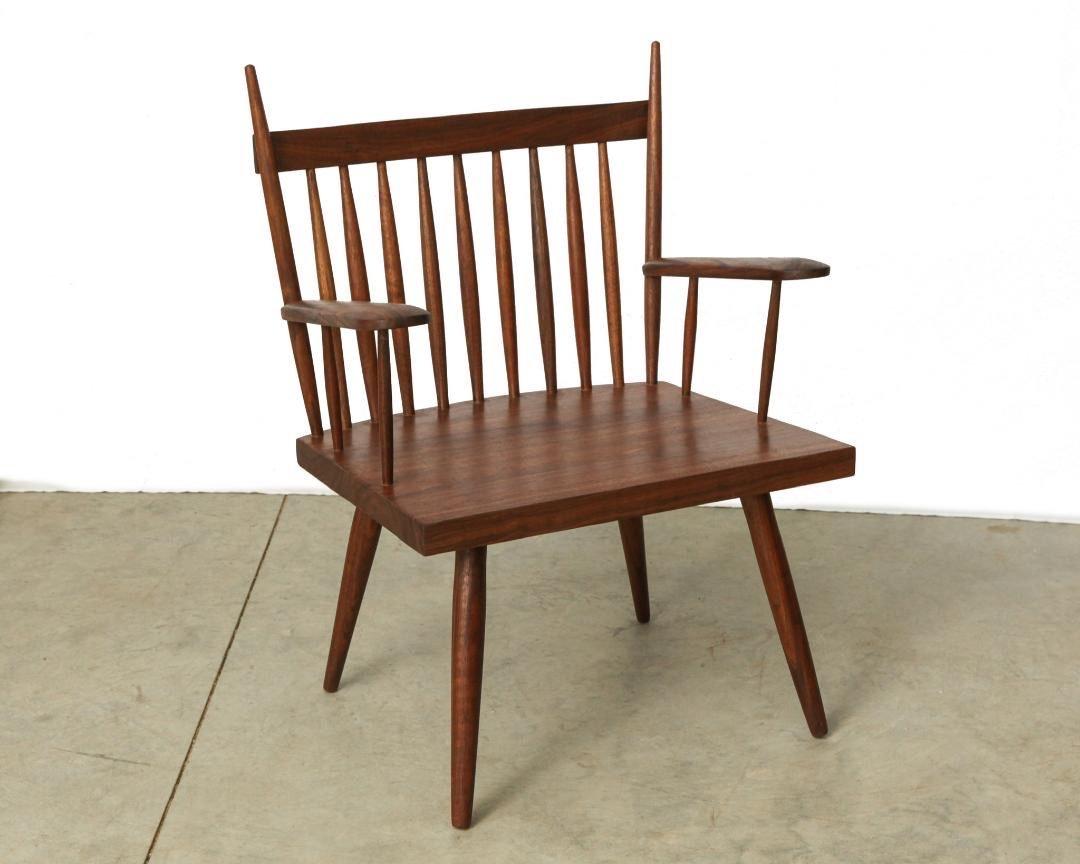 Chair with armrests by Michael Rozell, USA, 2021. The chair has a slightly tapered back atop of thin spindles.