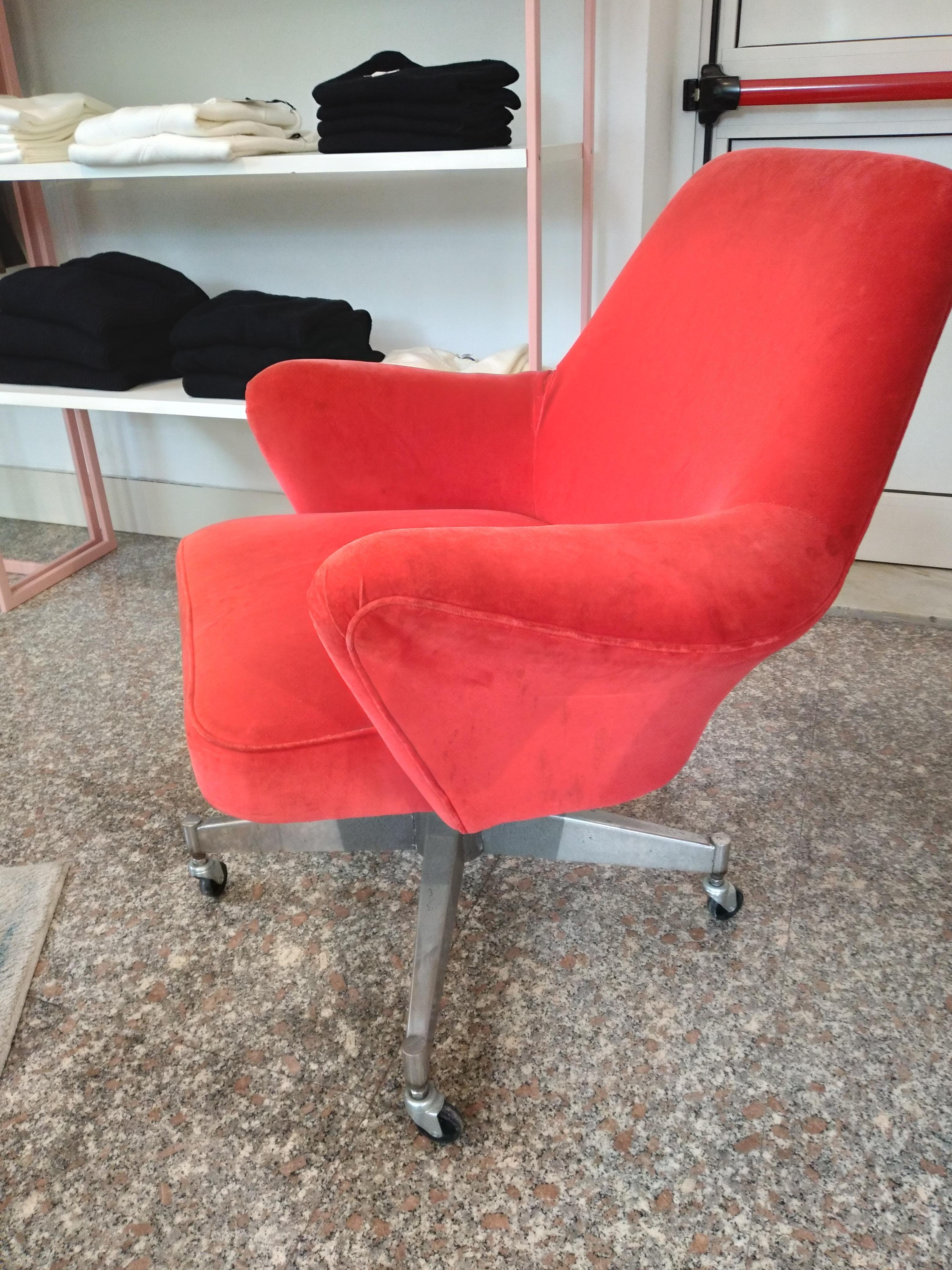 Armchairs by Osvaldo Borsani Italy 1960s 
The armhairs has the whelles and is swivel the padden part retains the original Red Velvet and is mounted in a revolving metal pedestal with wheels .
Very confortable.
I am available for any information.
