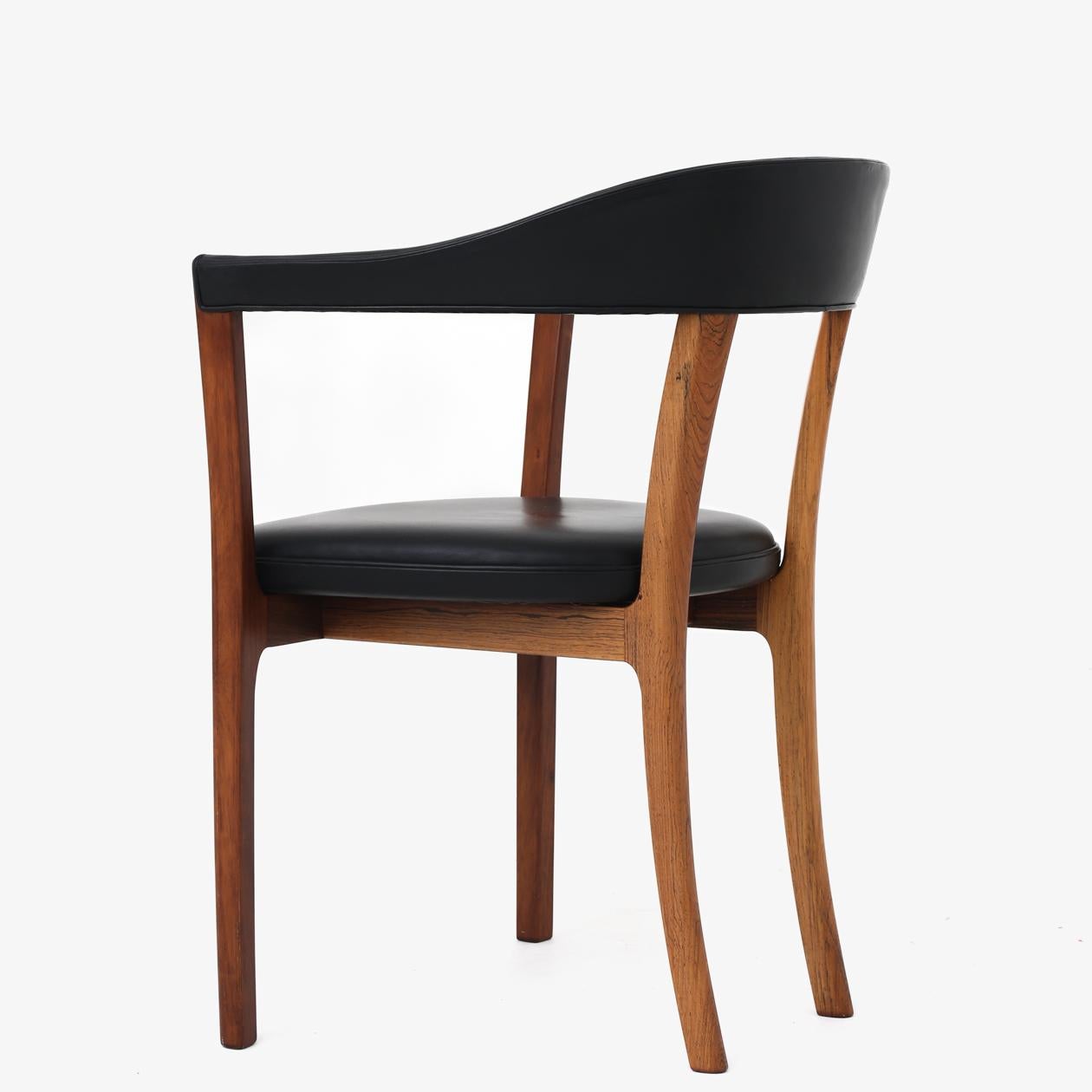 Armchair in rosewood and black leather. Ole Wanscher / A.J Iversen.