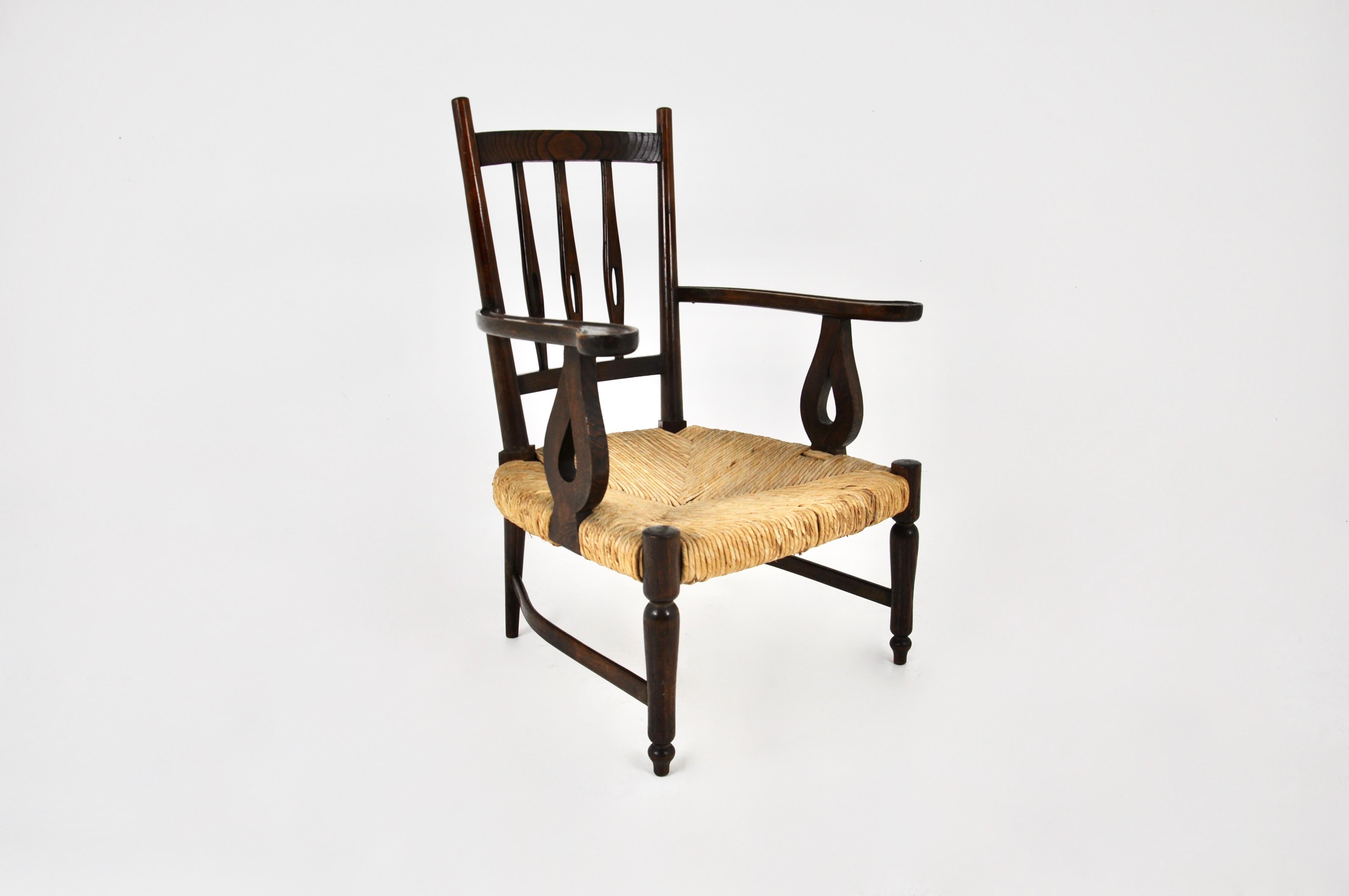 Wood and wicker armchair by Paolo Buffa made in the 50s.  Seat height: 32 cm. Wear due to time and age.