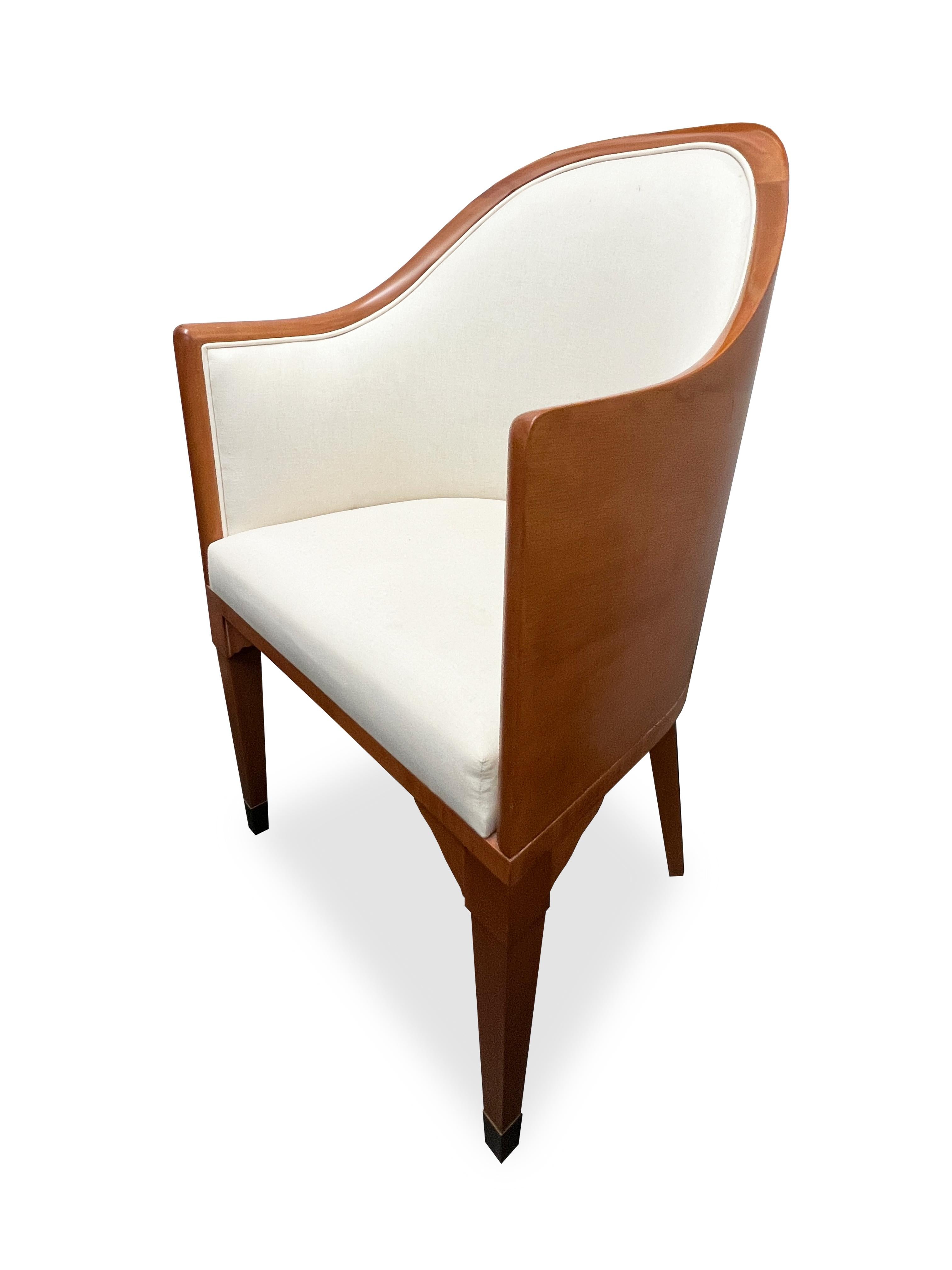 Wooden armchair design by Juan Montoya design. Sleek and comfortable chair with brass details on the legs. 

Property from esteemed interior designer Juan Montoya. Juan Montoya is one of the most acclaimed and prolific interior designers in the