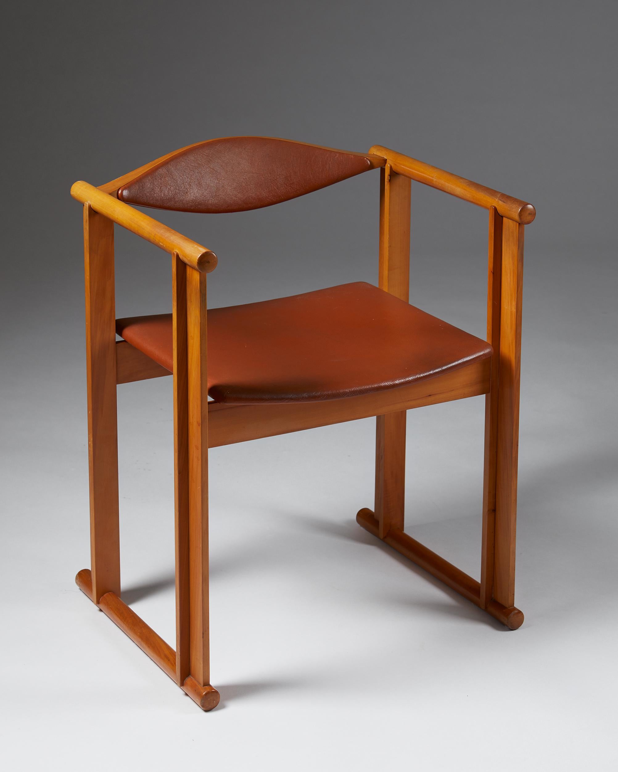 Armchair designed by Anders Berglund and Gösta Engström for Hans Johansson, HI-Gruppen, Sweden. 1960's.

Cherry wood frame, back and seat upholstered in leather.

Measurements: 
H: 69 cm/ 2' 3