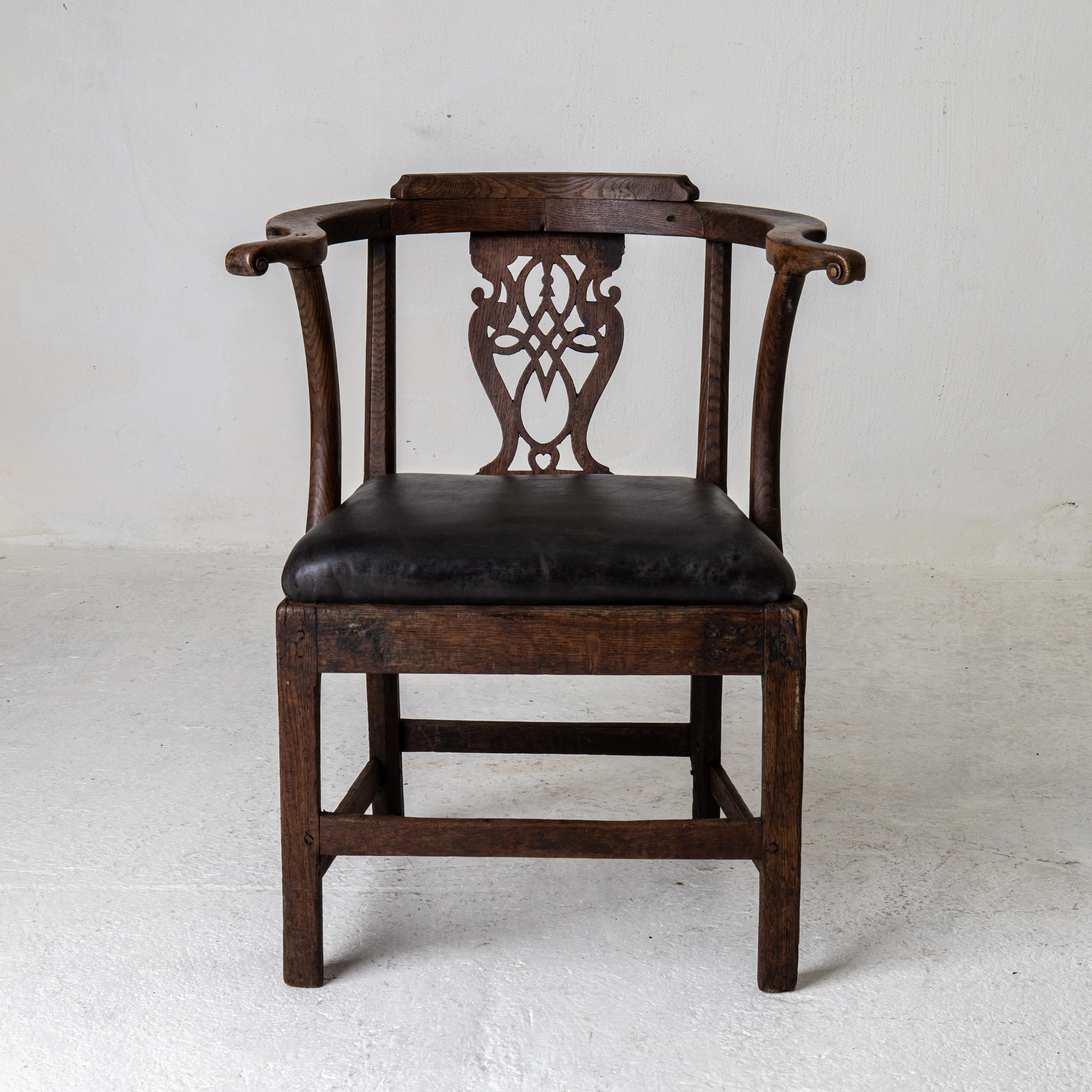 Armchair Early 19th Century England. An armchair made during the early part of the 19th century in Enland. Frame made from walnut. Seat upholstered in a black leather.