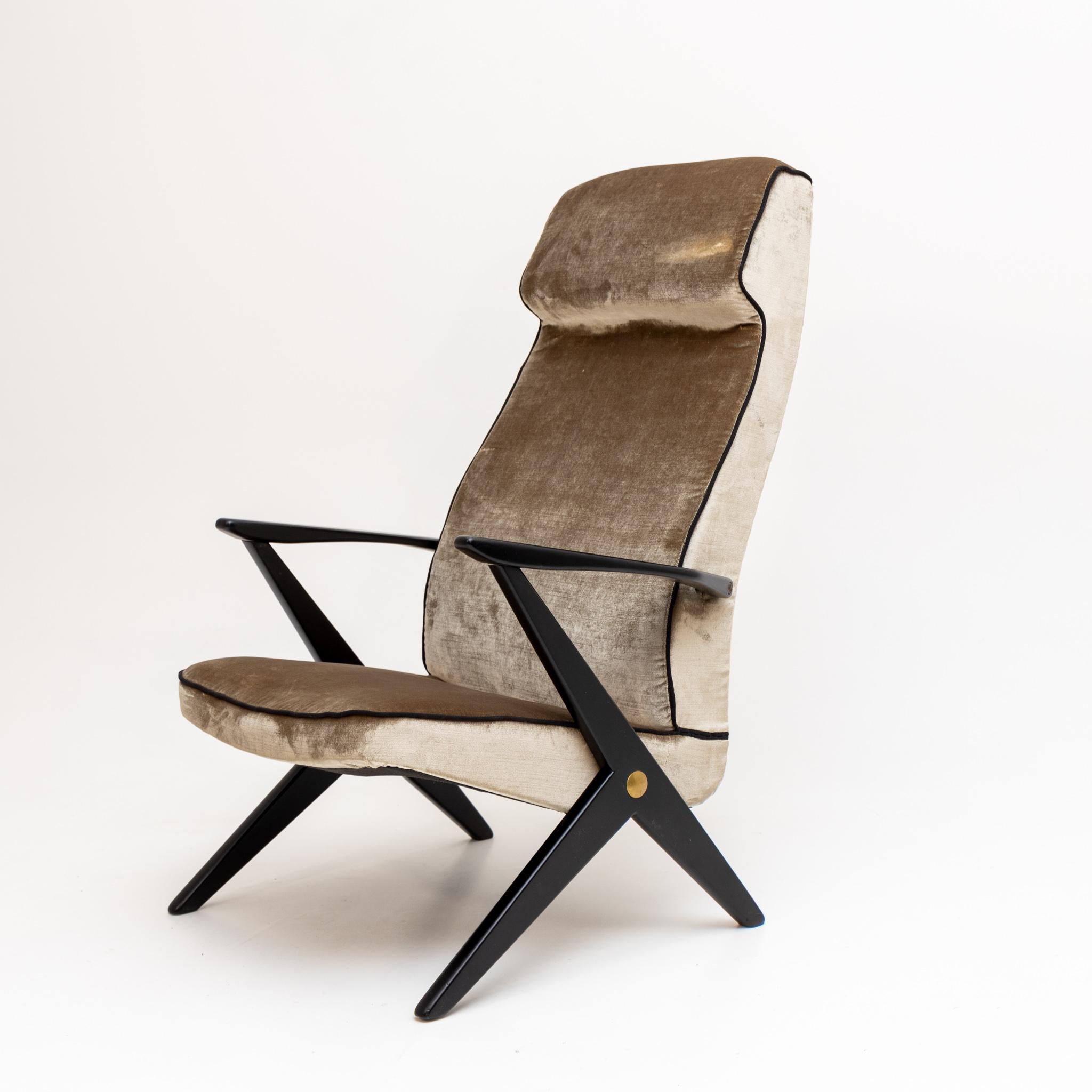 Armchair with ebonized frame and newly upholstered seat and backrest in grey velvet.