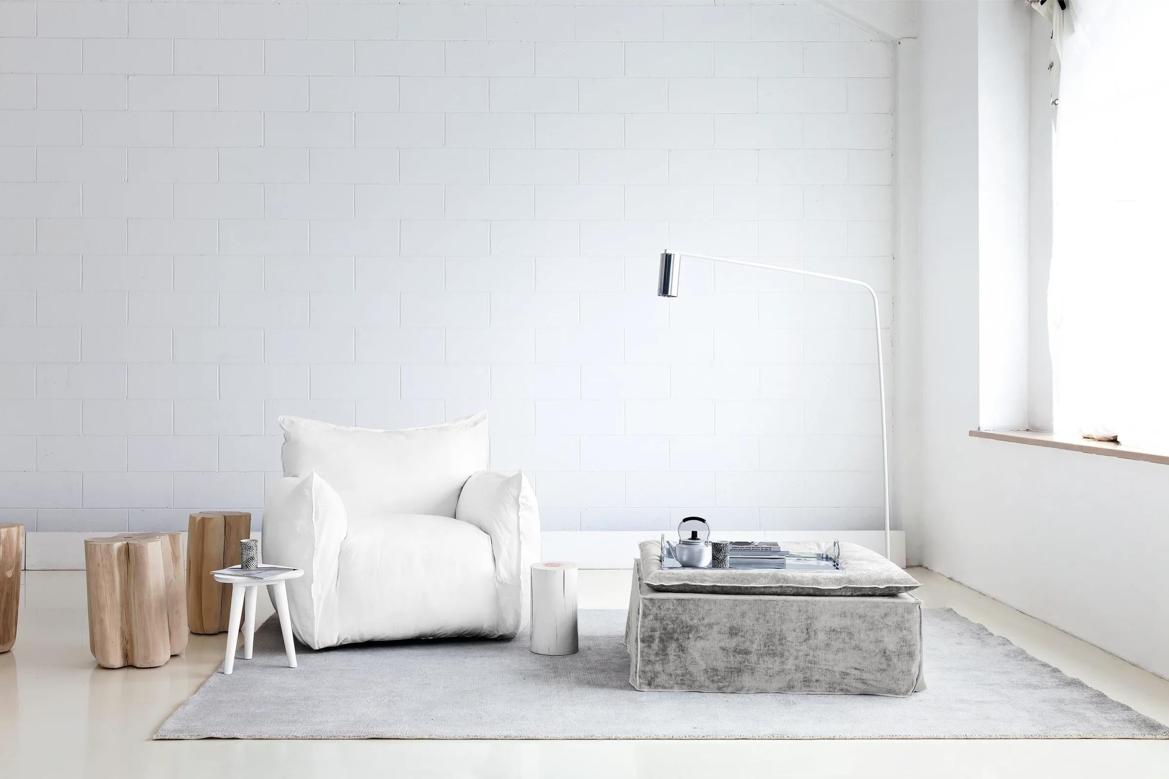 Gervasoni Nuvola 09 Armchair
Design: Paola Navone

The Nuvola collection is defined by its soft, inviting shapes that embody comfort and informality. The Nuvola 09 armchair has an aesthetic that invites you to sink in: the high armrests embrace a