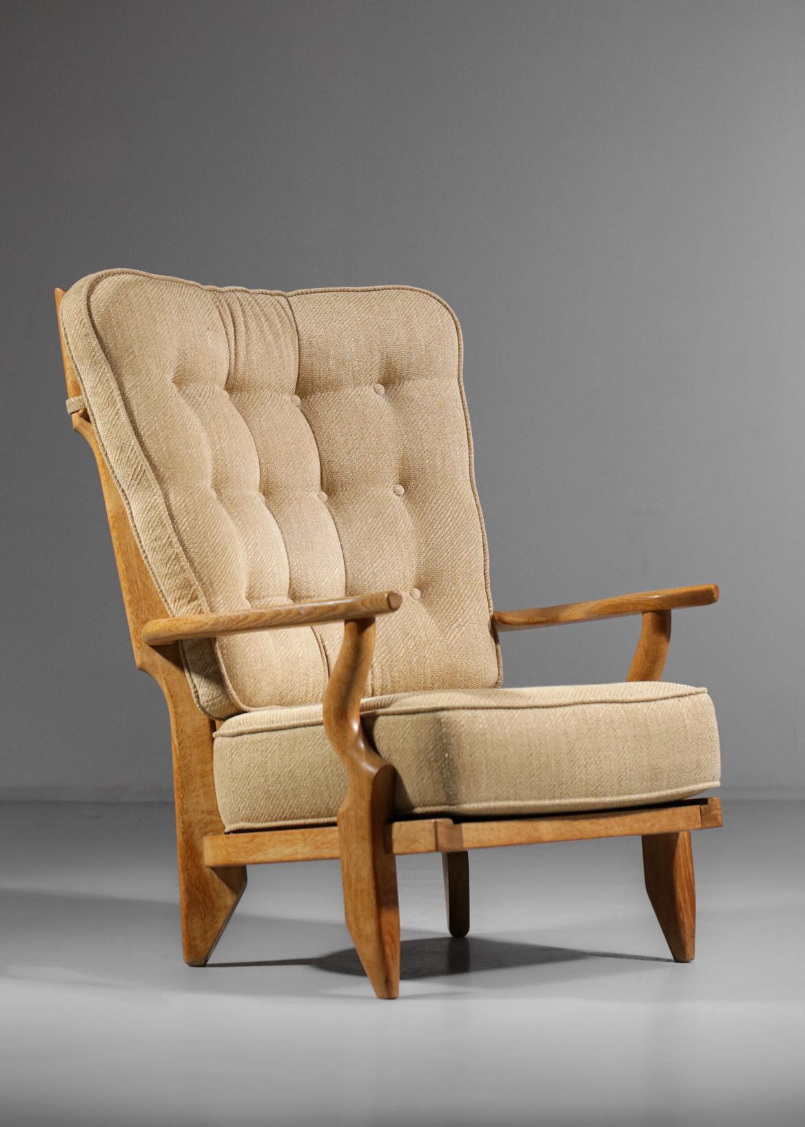 Large armchair by the French designers Guillerme and Chambron from the 60's edited by Votre Maison. Solid light oak structure, original seat and back cushion (reupholstered in the past) covered with wool in beige/brown colours. Excellent vintage