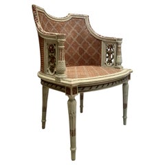 Armchair in Green Cane with Carved Pink Flowers in the Romantic Louis XVI Style