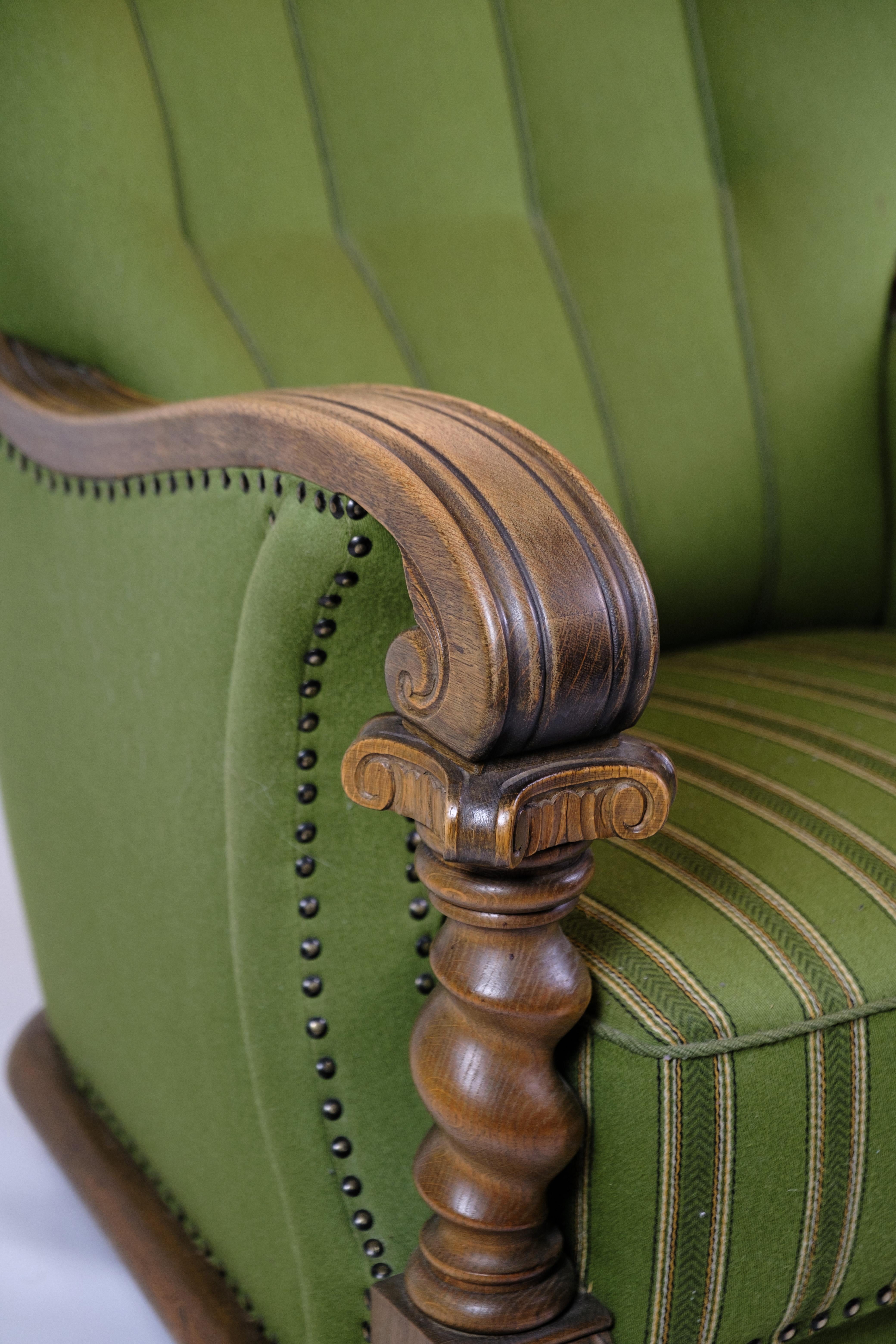 Danish Armchair in Green Fabric with Wood Carvings from 1920s. For Sale