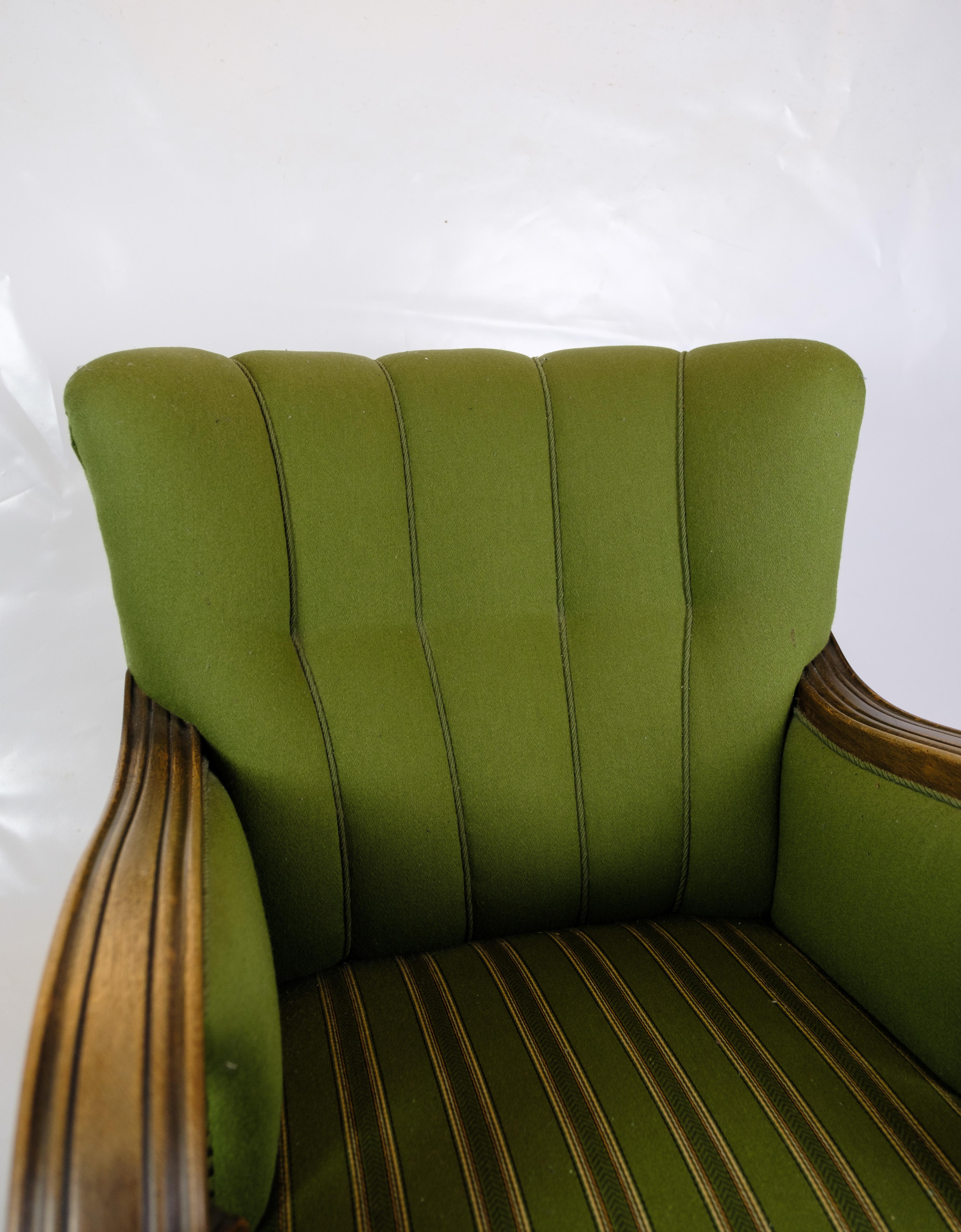 Early 20th Century Armchair in Green Fabric with Wood Carvings from 1920s. For Sale