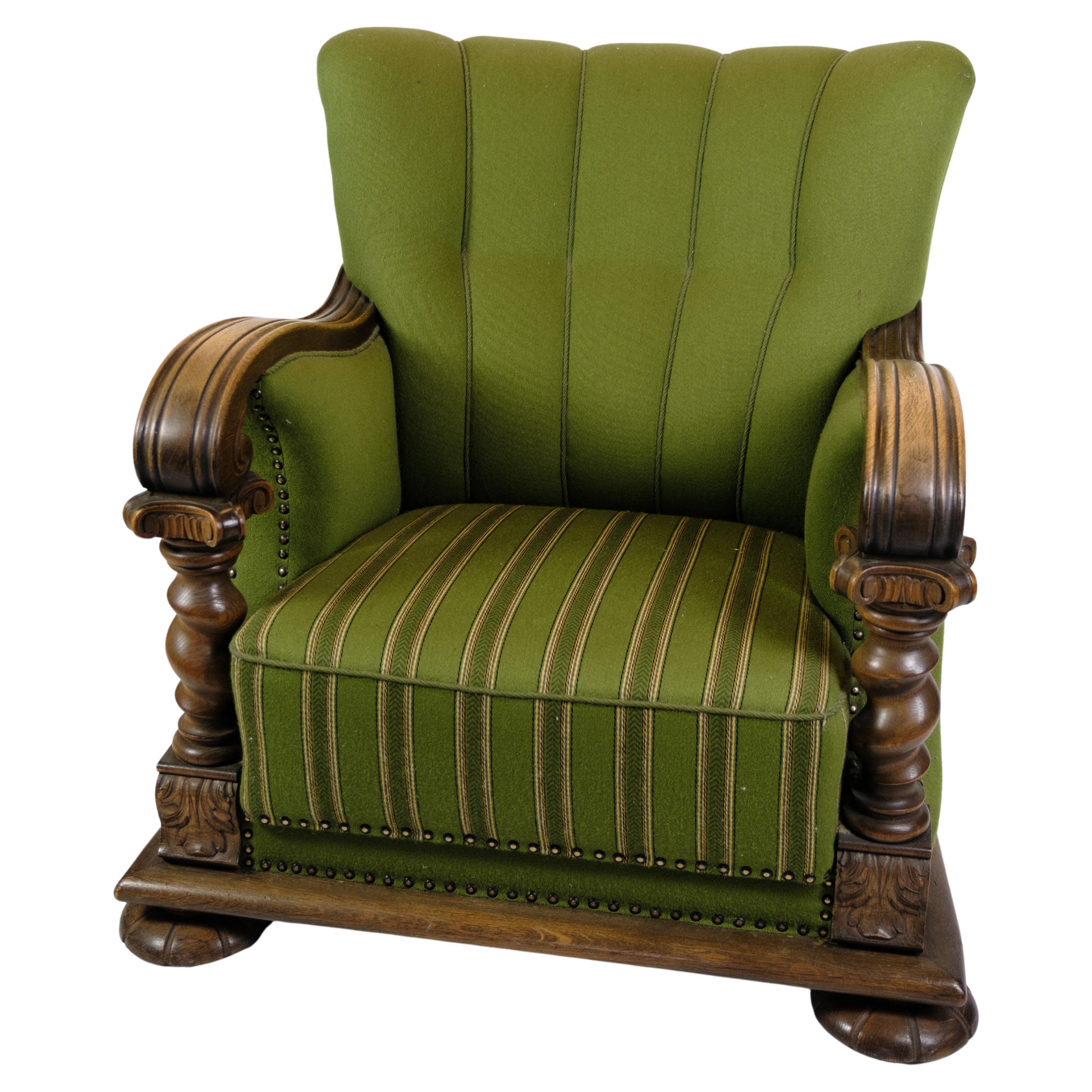 Armchair in Green Fabric with Wood Carvings from 1920s. For Sale