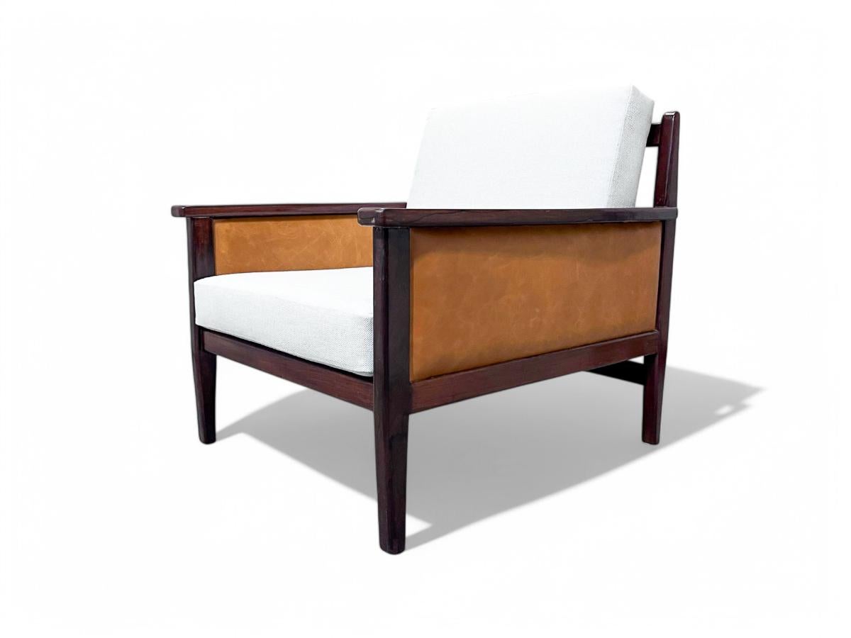 Elevate your living space with this exquisite armchair, crafted by the talented Fatima in Brazil during the 1960s—a true embodiment of exceptional craftsmanship. 

This stunning piece showcases a Brazilian rosewood frame, featuring robust arms and