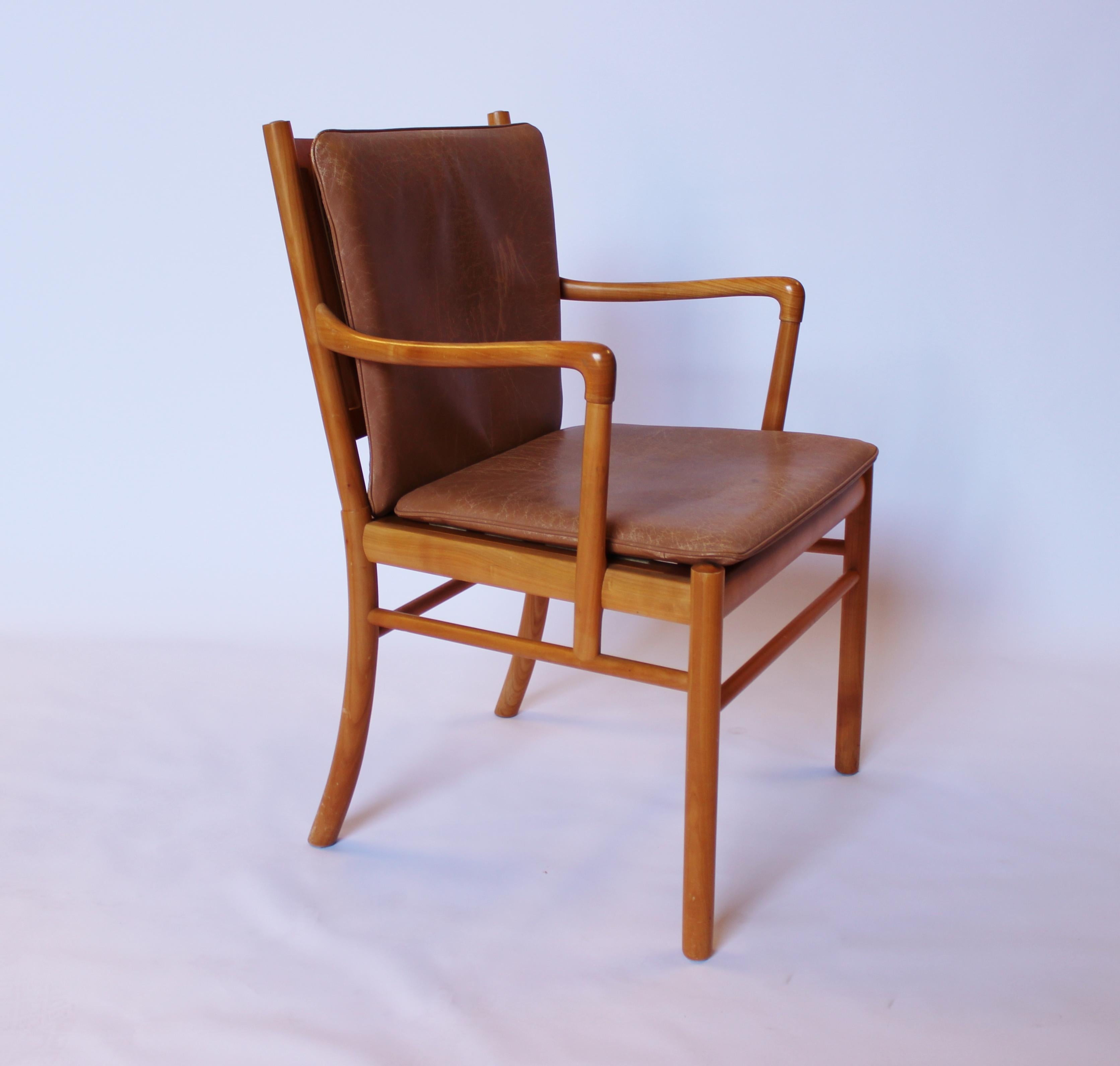 Armchair in mahogany and with cushions of light brown patinated leather, model PJ-301 designed by Ole Wanscher and manufactured by PJ Furniture in the 1960s. The chairs is in great vintage condition.
