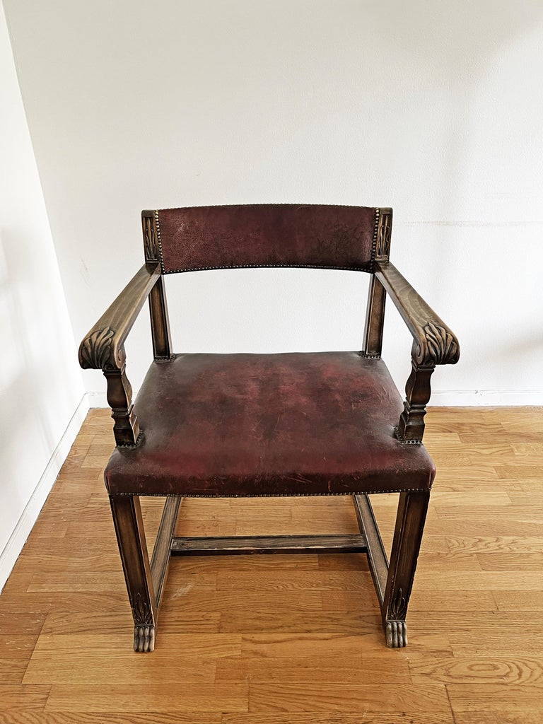 Cool chair with oak frame and seat in leather, circa 1920-1930s.
Beautifully crafted arms and legs. Patina on the leather. 
Marked with H under the seat, as seen on the last picture. 

Leather on the seat has patina and dry cracks, consistent
