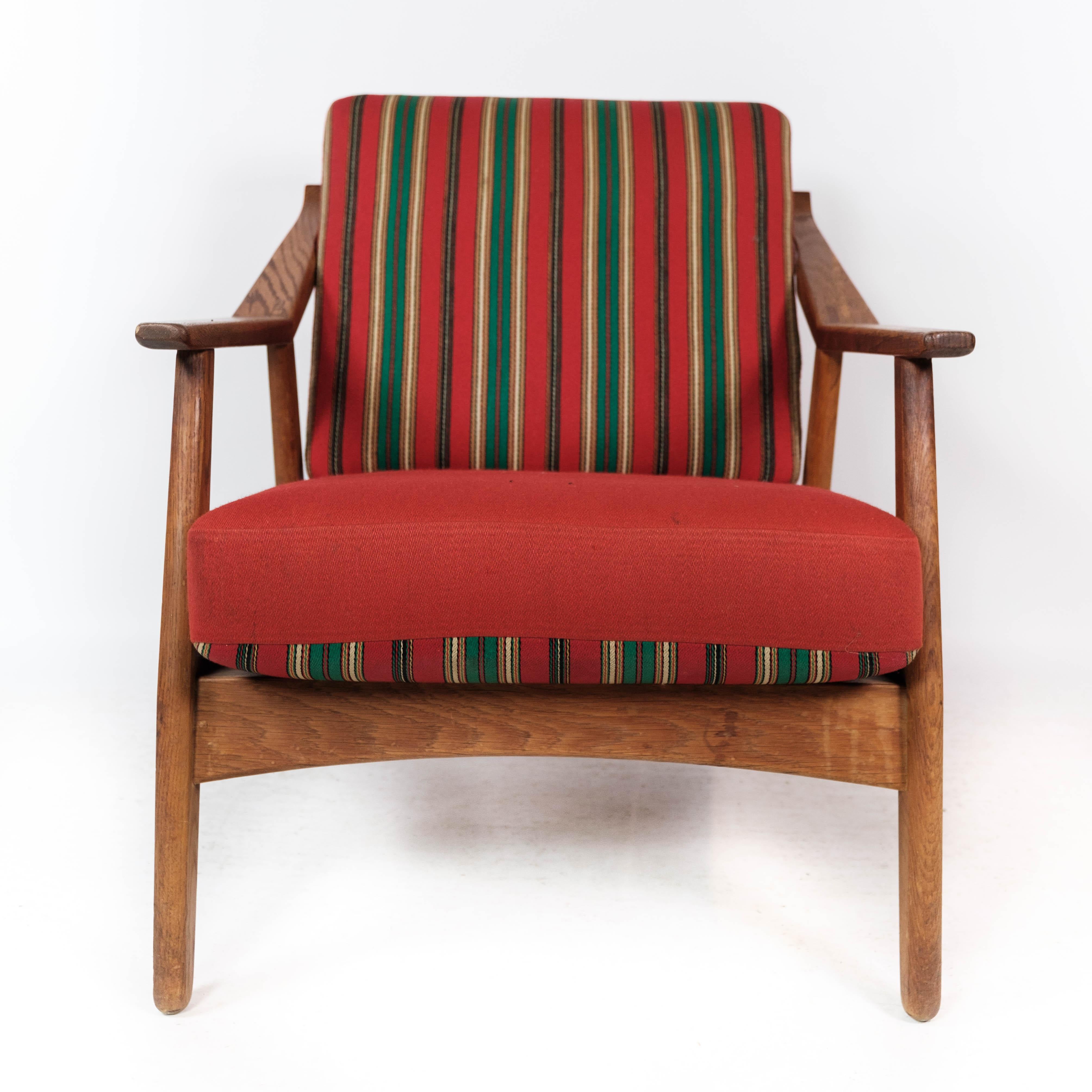 Scandinavian Modern Armchair in Oak and Upholstered with Red Fabric, by H. Brockmann Petersen, 1960s For Sale