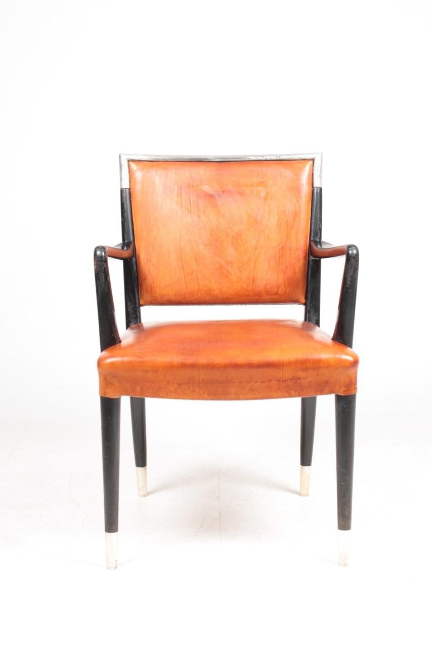 Armchair in patinated leather, made by Lysberg Hansen & Terp in 1940s. Made in Denmark. Great condition.