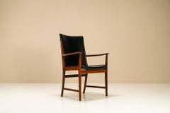 Fauteuil en bois de rose et cuir de Kai Lyngfeldt Larsen, Danemark, années 1960