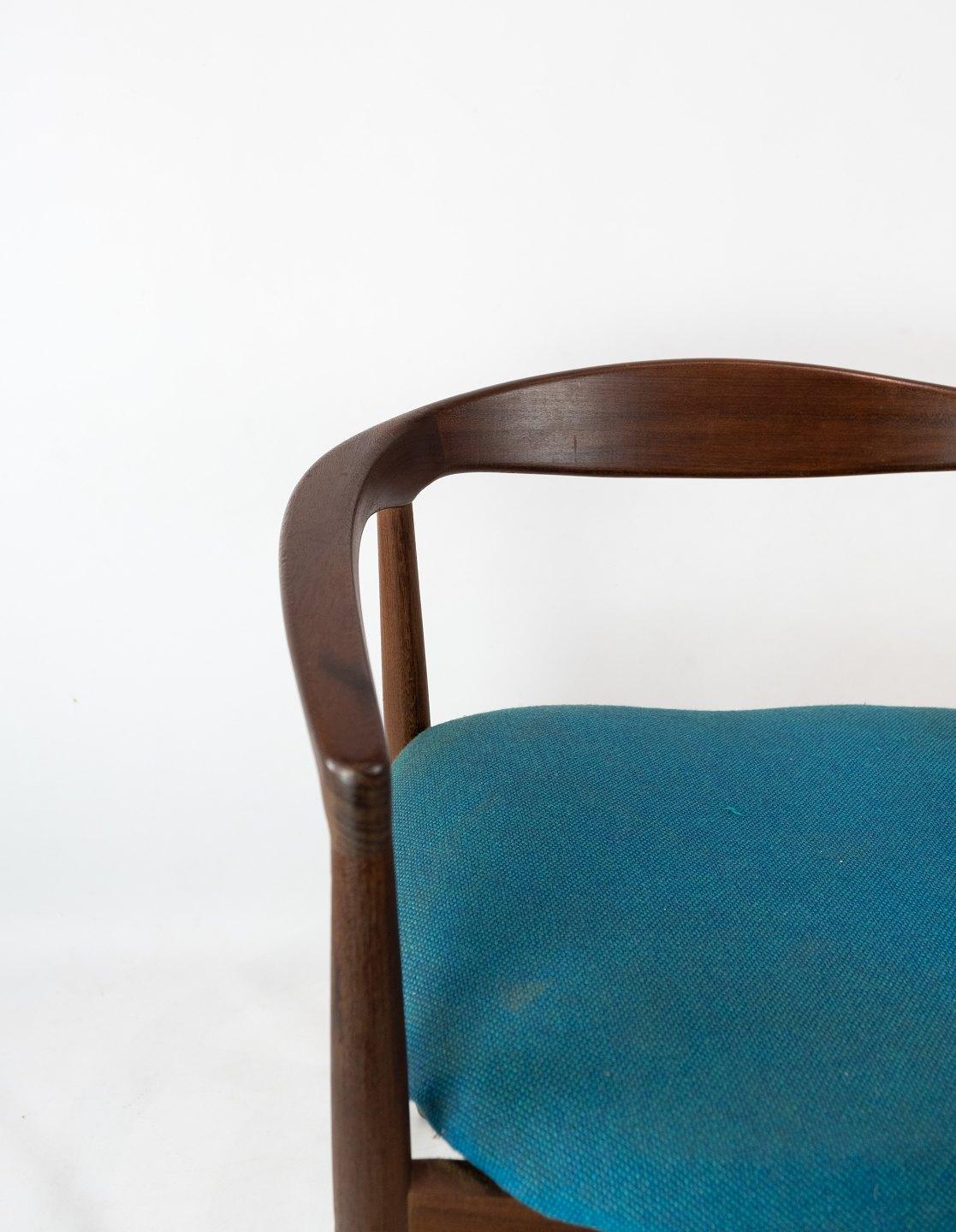 Armchair in rosewood, model Troja, upholstered with blue fabric designed by Kai Kristiansen from the 1960s. The chair is in great vintage condition.
 
