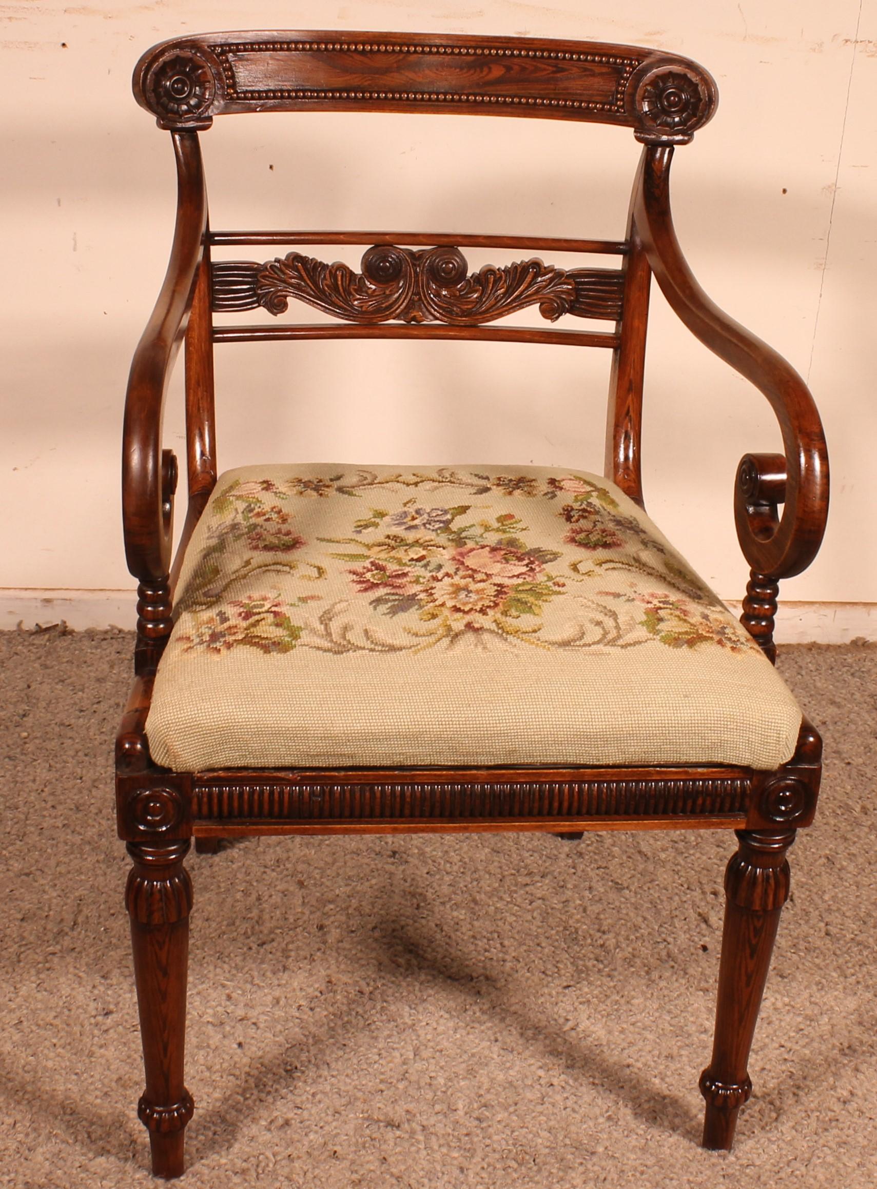 Lovely rosewood armchair from the beginning of the 19th century Regency period
Very beautiful base decorated with a beading The backrest is also decorated with a beading as well as a carving in its centre
The seat is lined with a tapestry (removable