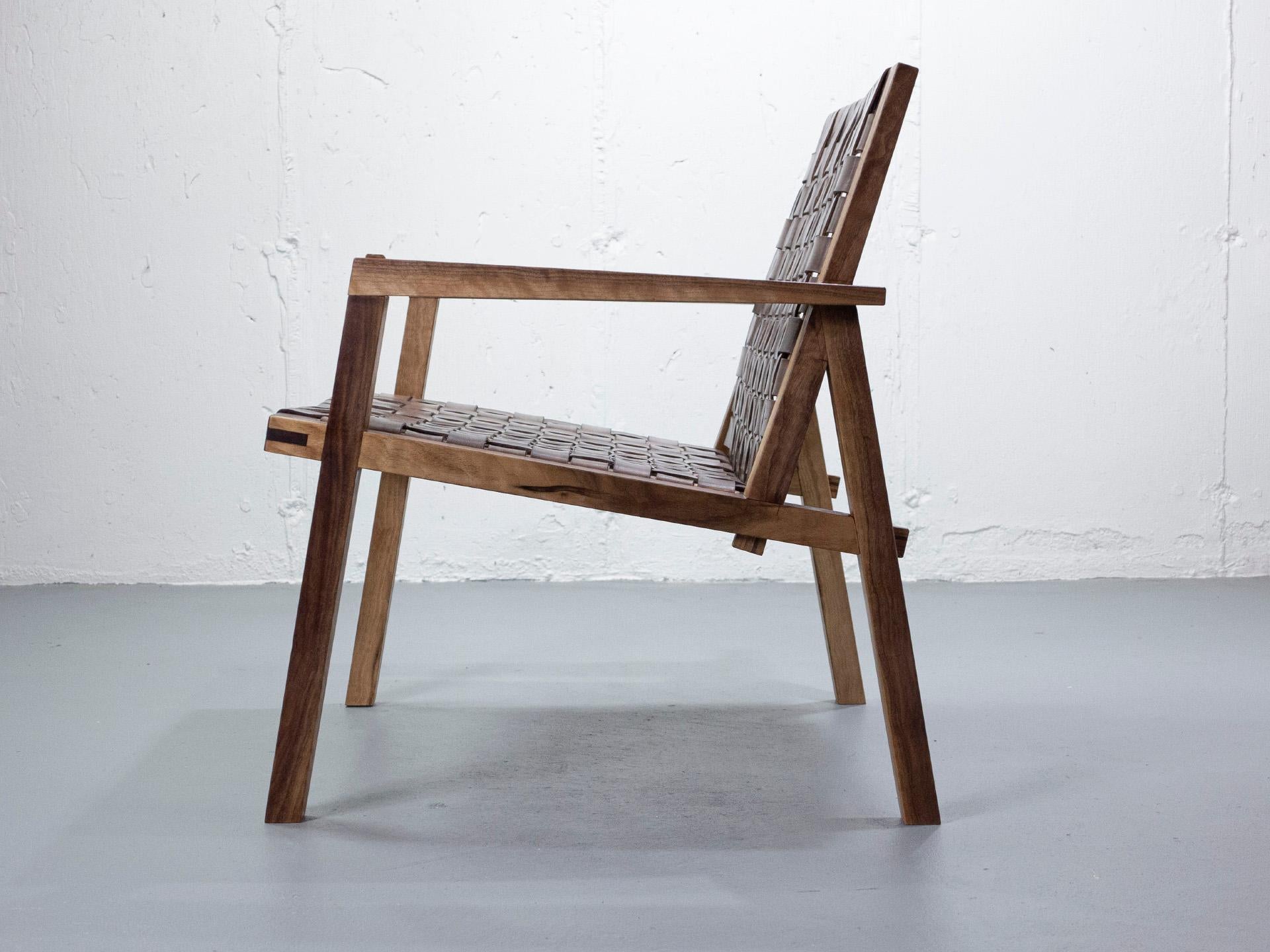 Glass ARMCHAIR in solid black walnut with vegetable tanned leather webbing. For Sale