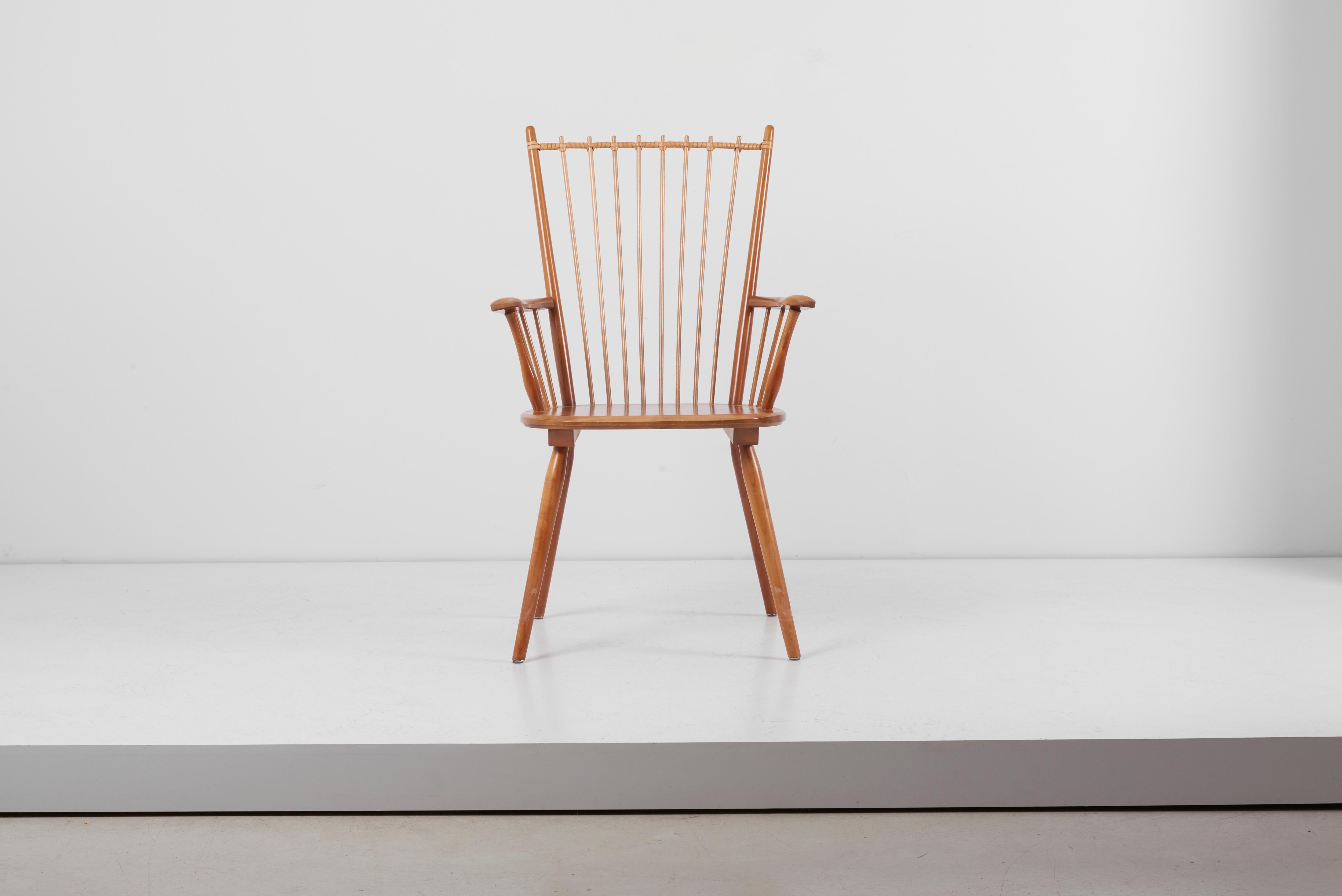 Rare architectural Arts & Crafts chair, designed circa 1949 by Albert Haberer and manufactured by Hermann Fleiner in Stuttgart, Germany. The flexible backrest is made of thin spindles, held together with a leather connection. The leather is a