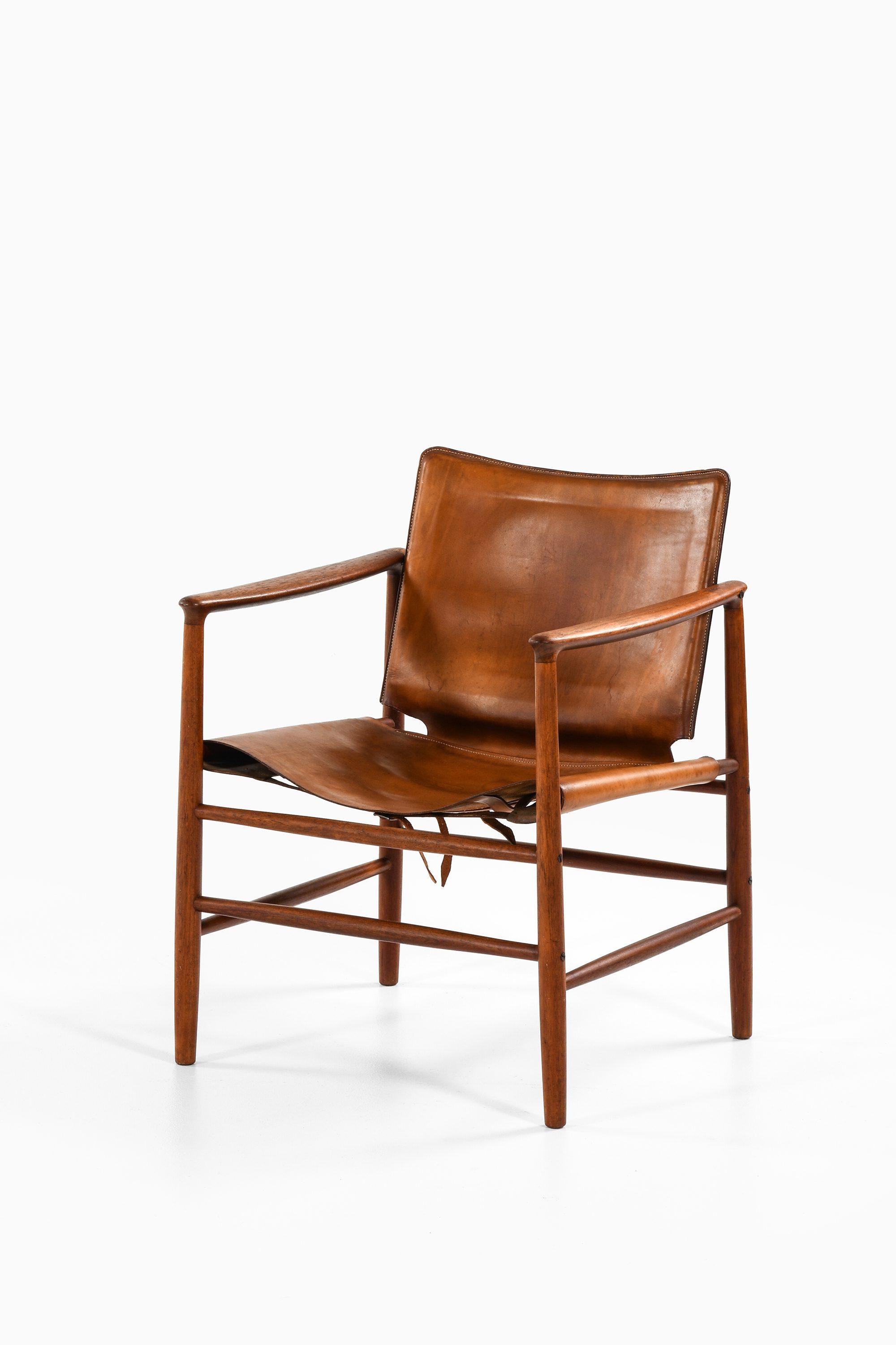 Armchair in Teak and Leather by Kai Lyngfeldt Larsen, 1957

Additional Information:
Material: Teak and leather
Style: Mid century, Scandinavian
Produced by Bovirke in Denmark
Dimensions (W x D x H): 58.5 x 60 x 75 cm
Seat Height: 37 cm
Condition:
