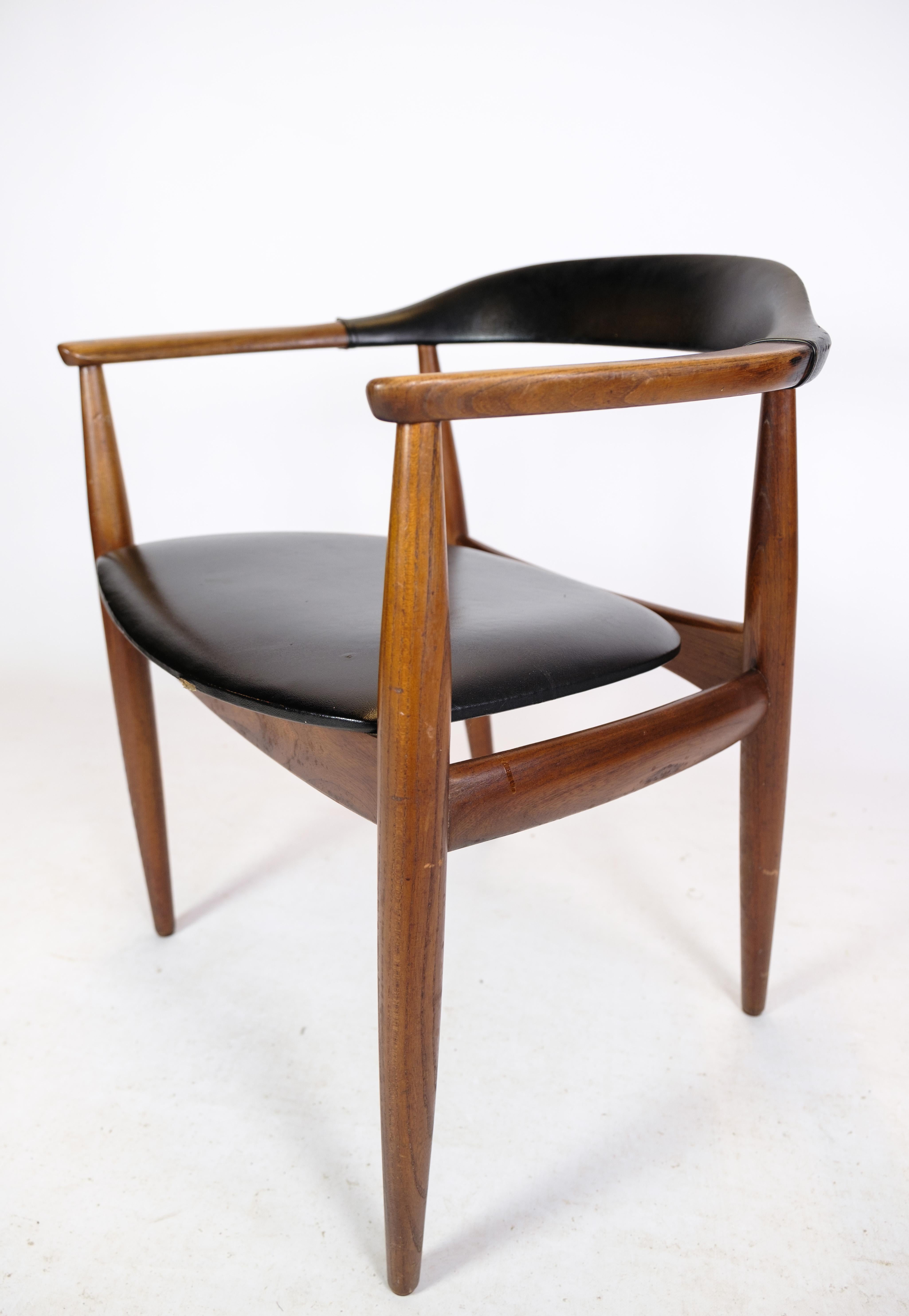 Scandinavian Modern Armchair in Teak Wood and Black Leather by Illum Wikkelsø & Niels Eilersen 1960 For Sale