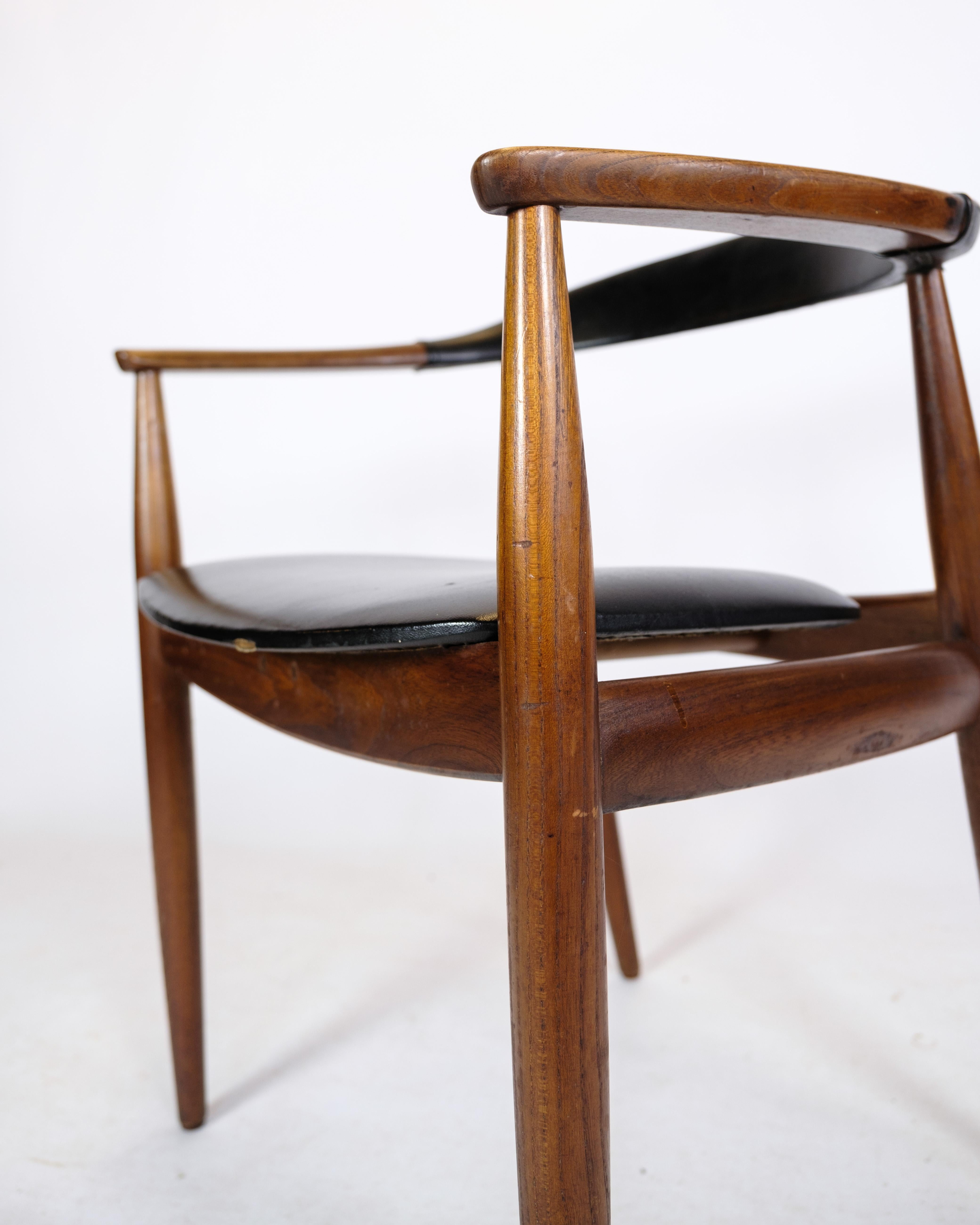 Danish Armchair in Teak Wood and Black Leather by Illum Wikkelsø & Niels Eilersen 1960 For Sale