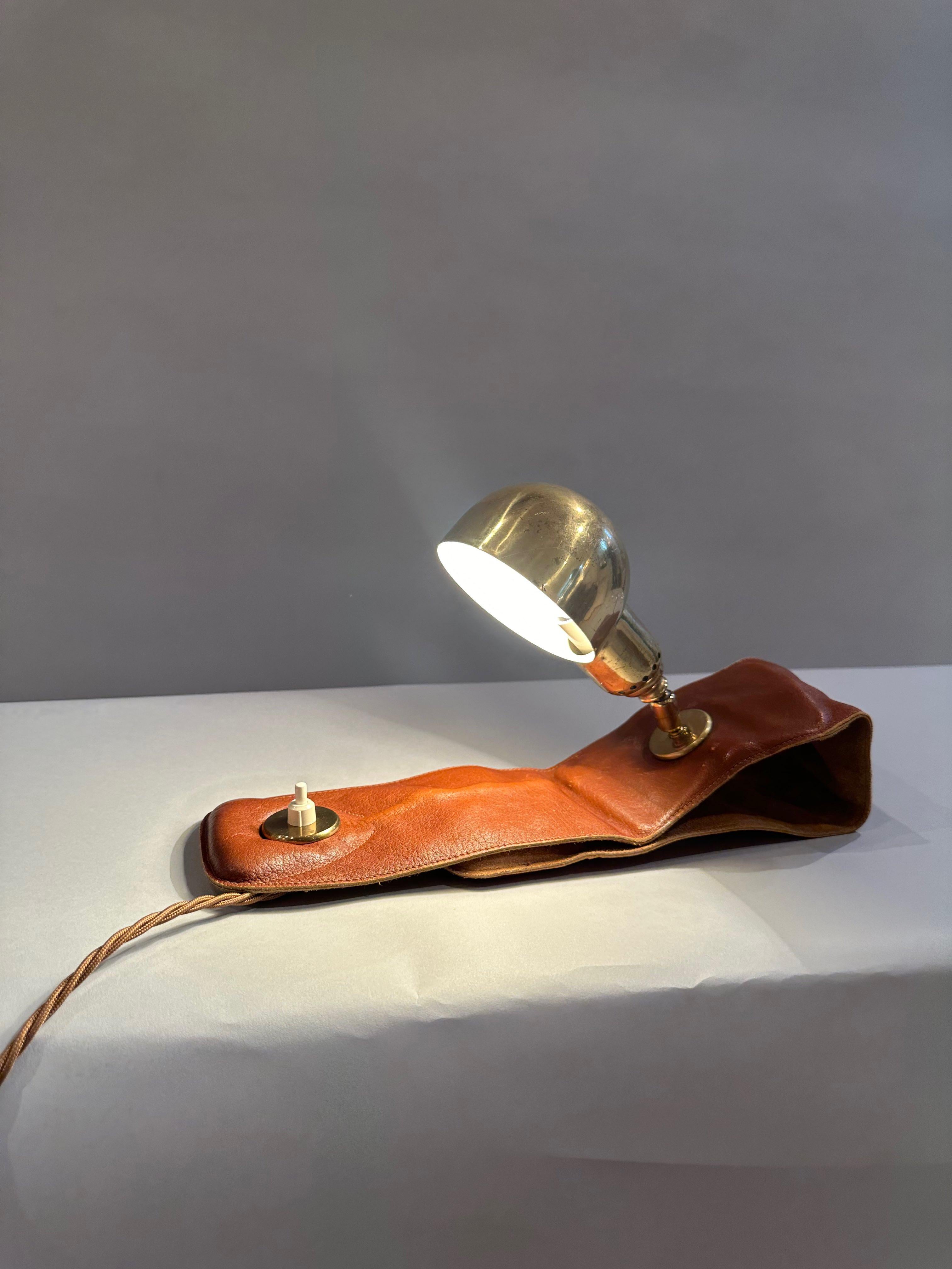 Brown leather and brass armchair lamp by Luigi Dominioni Italy c1970

The leather on this example is very soft. 

Minimal patina on leather with some surface scratches to brass.

