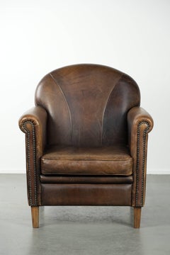 Armchair / lounge chair made of sheepskin leather with characterful patina