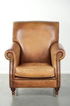Armchair made of cowhide leather with a characterful English look