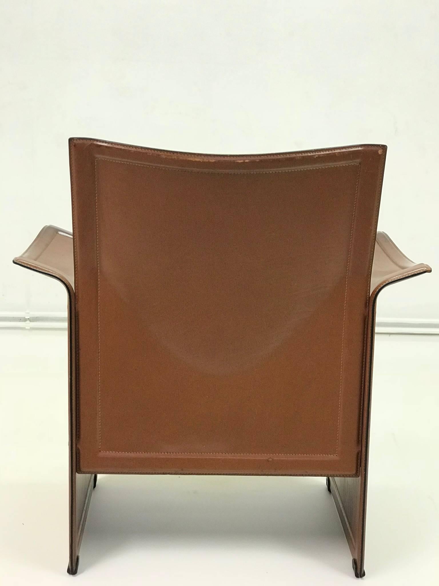 The leather charming armchair is made by Italian manufacture. It is characterized by ungular design. The color is dark brown. Sitting on the armchair is very comfortable.
