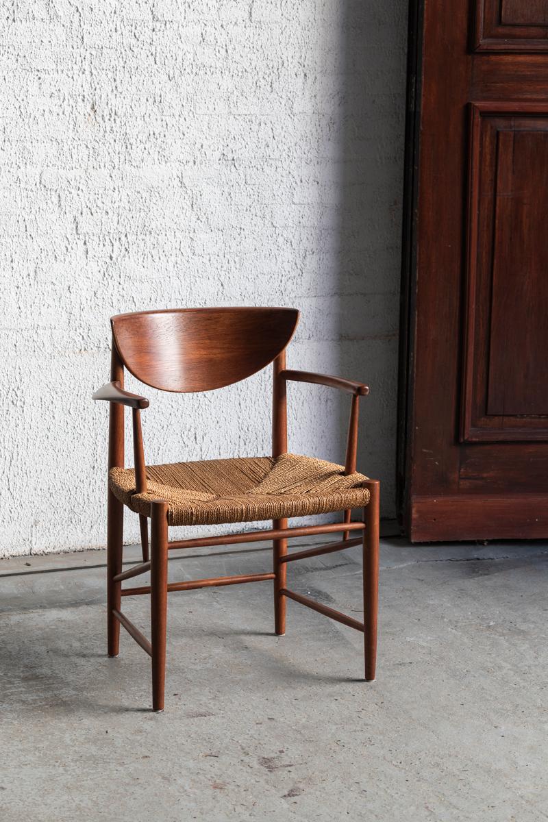 Armchair designed by Peter Hvidt and Orla Molgaard for Soborg Mobler in Denmark around 1960. This beautiful chair has a solid teak frame and twisted rush seating. In very good condition.

We also have a matching model 316 in stock.

H: 76 cm
W: 60