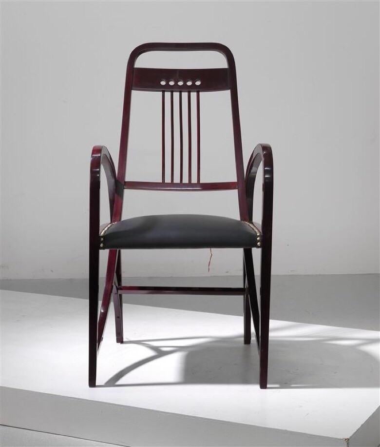 Armchair model 511, manufactured by Gebrüder Thonet Vienna, circa 1904, four-legged design, square-cutwood, black-brown stained, renewed seat with decorative nails. Dimensions height about 105 cm, width about 55 cm, depth about 60 cm.