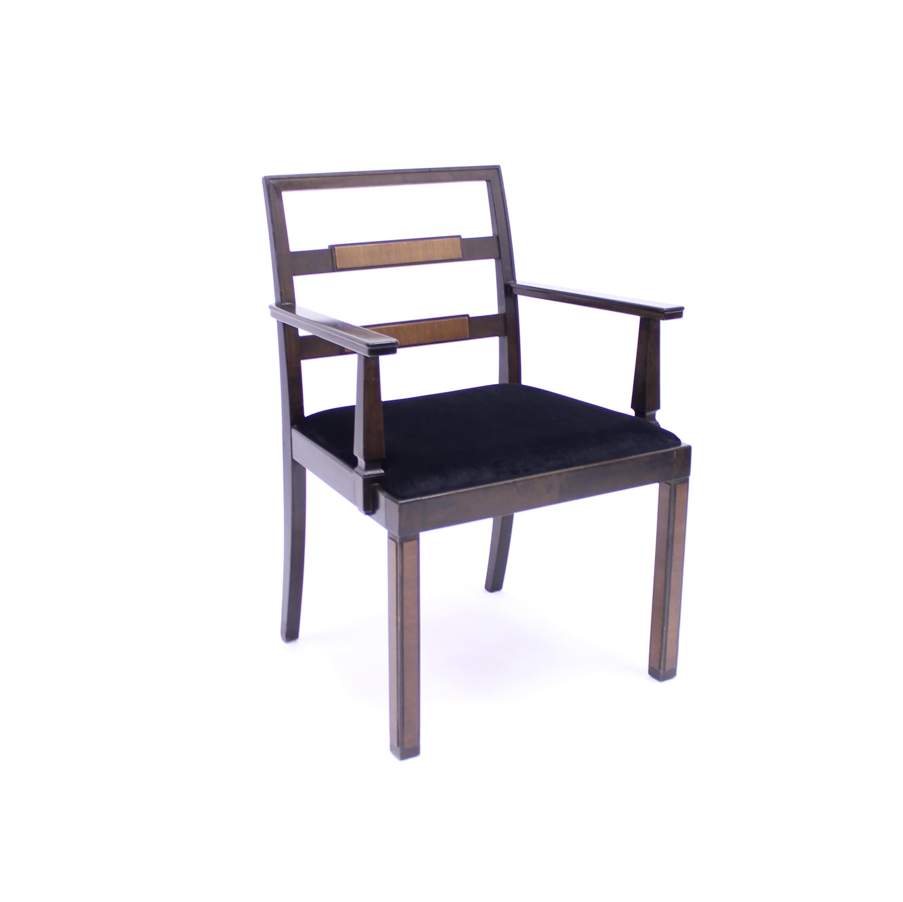 Armchair, model Empire, attributed to Axel Einar Hjorth, manufactured by Nordiska Kompaniet. Produced in 1934. Stained Birch frame with Walnut inlays on the backrest and legs. New black velvet upholstery on the seat

This model is recorded in the