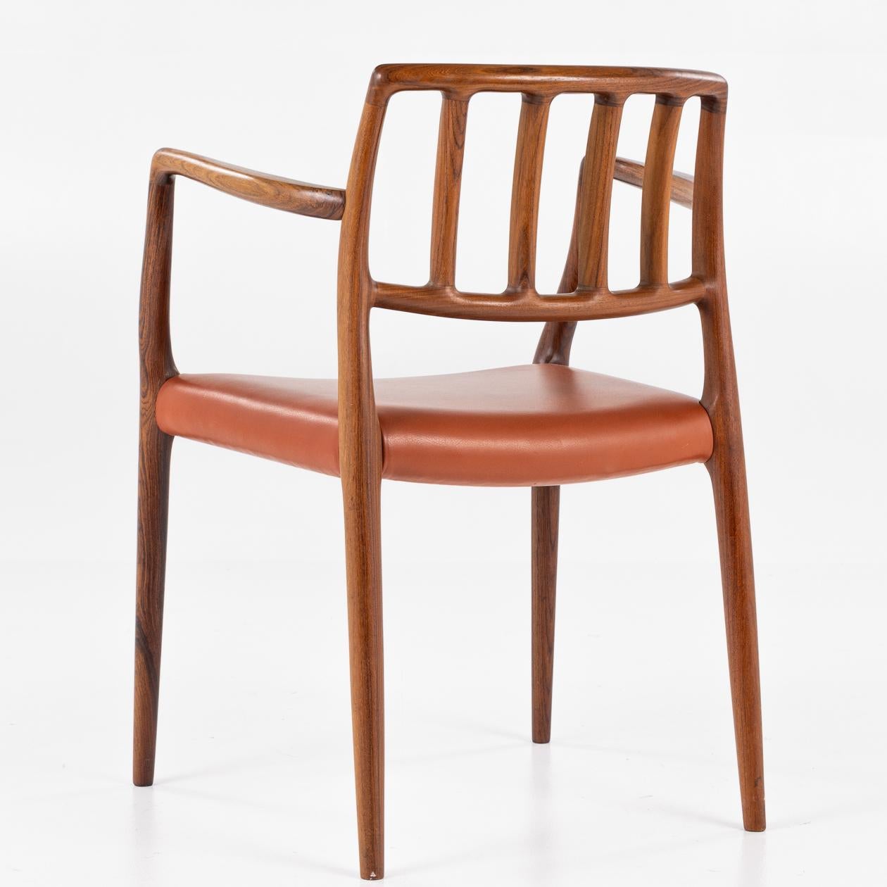 NO 66 - Armchair in rosewood and patinated leather seat. Niels O. Møller / J.L Møller