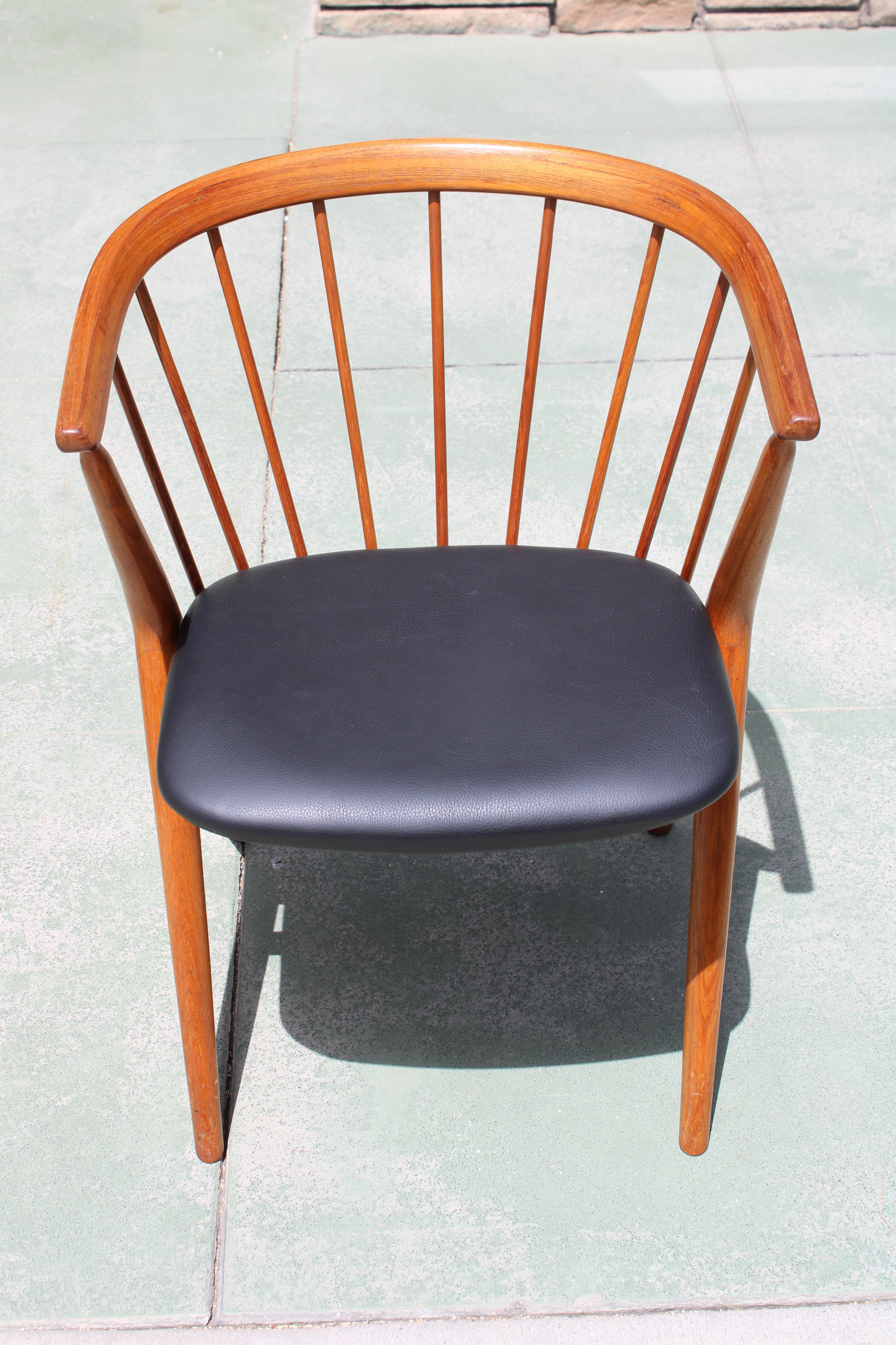 Armchair No. 8 by Helge Sibast, Denmark, 1953. Solid teakwood spindle frame with newly upholstered seat in natural black leather. Solid sturdy chair in beautiful condition. Chair measures 21.5