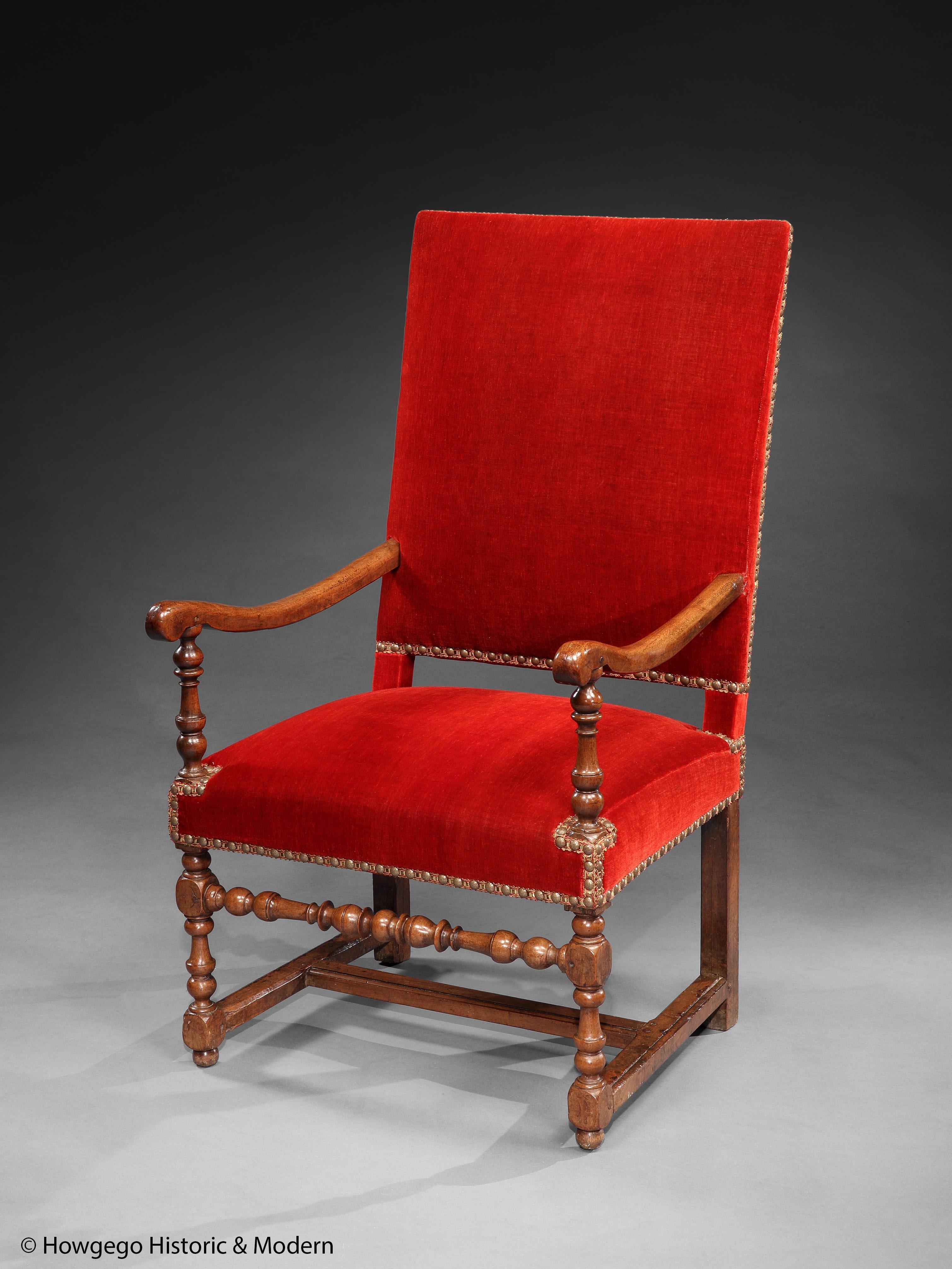 - Elegant period armchair injecting character to any interior
- Practical, sturdy and suitable for regular use
- Re-upholstered in a 19th century, rust, mohair velvet faced with rust and gold silk braid and gilded nails. 

The rectangular back
