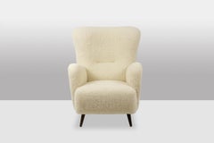 Armchair, or bergère, with its bouclette fabric. 1950s