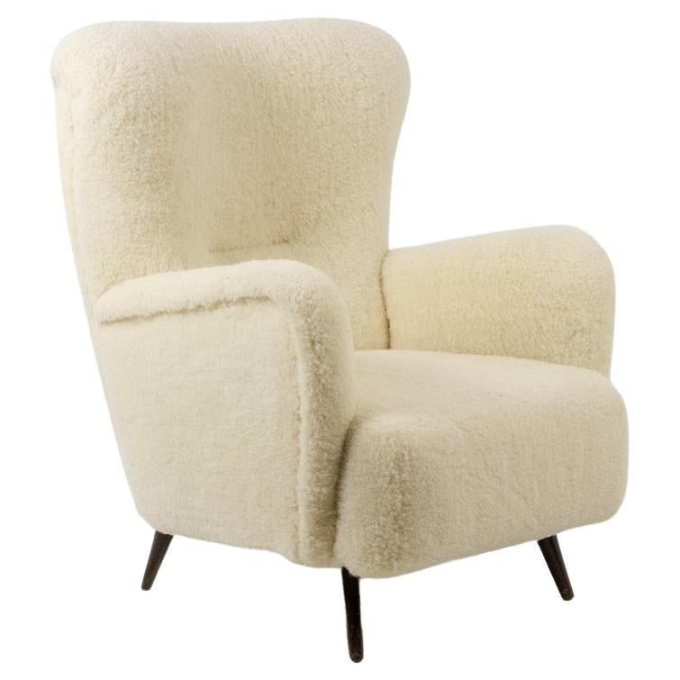 Armchair, or bergère, with its bouclette fabric. 1950s For Sale
