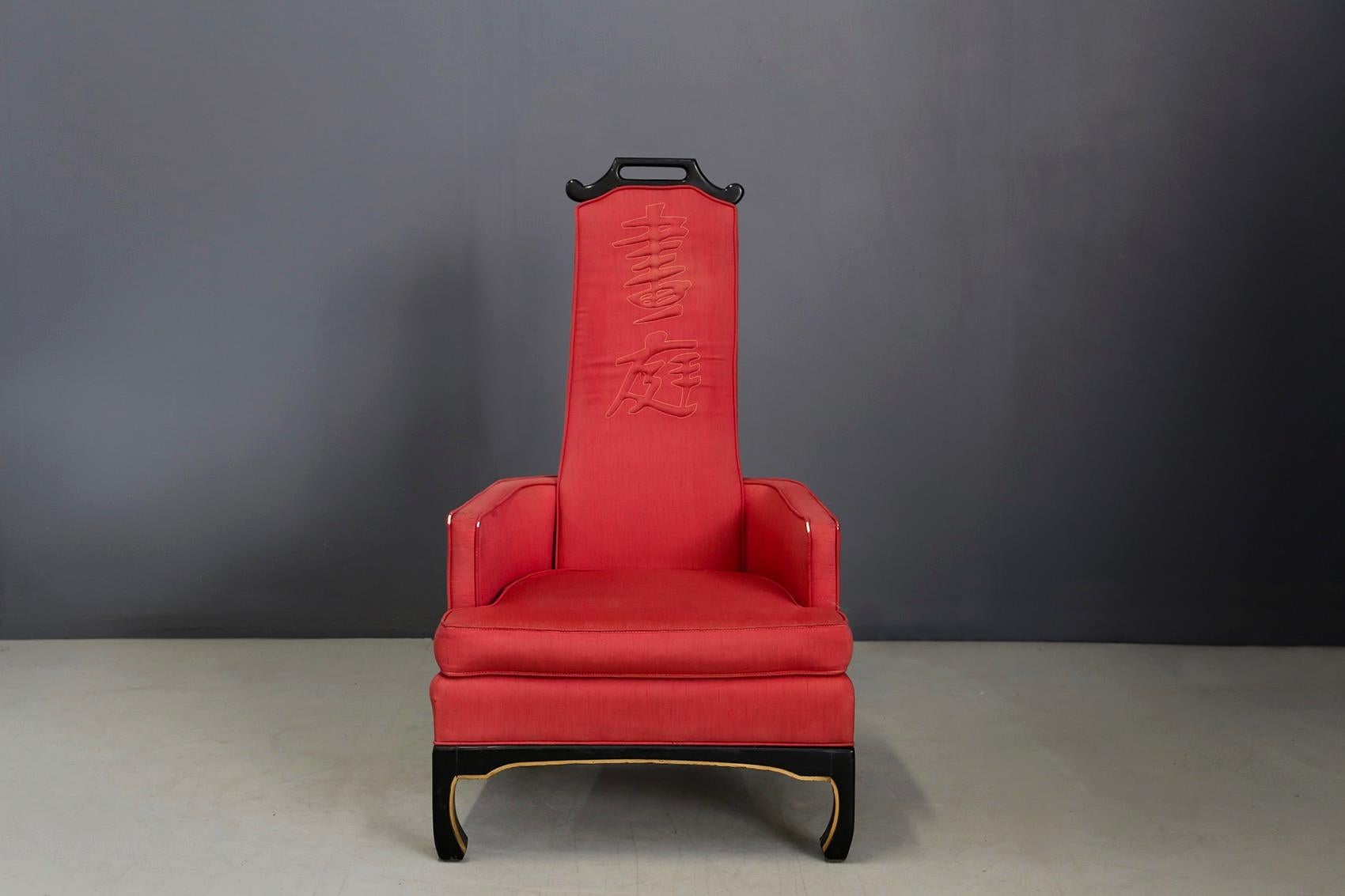 Armchair by Norman Fox MacGregor in Oriental style. The fabric is light red. The backrest has a Chinese inscription. Even its shapes are purely oriental. The armchair can also be classified as a throne. The base of the armchair is ebonized wood with